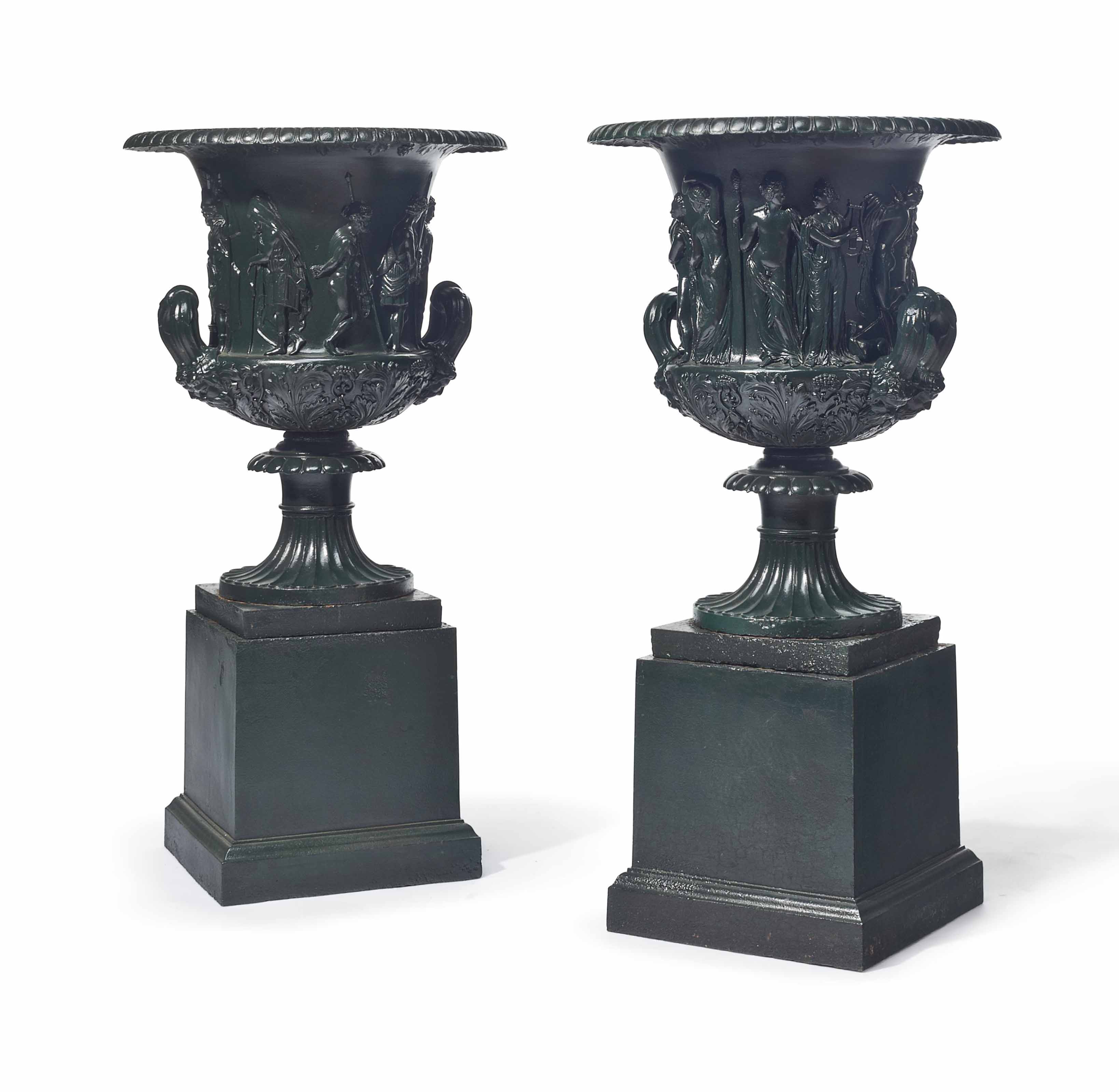 A PAIR OF GREENPAINTED CASTIRON GARDEN URNS , 20TH CENTURY Christie's