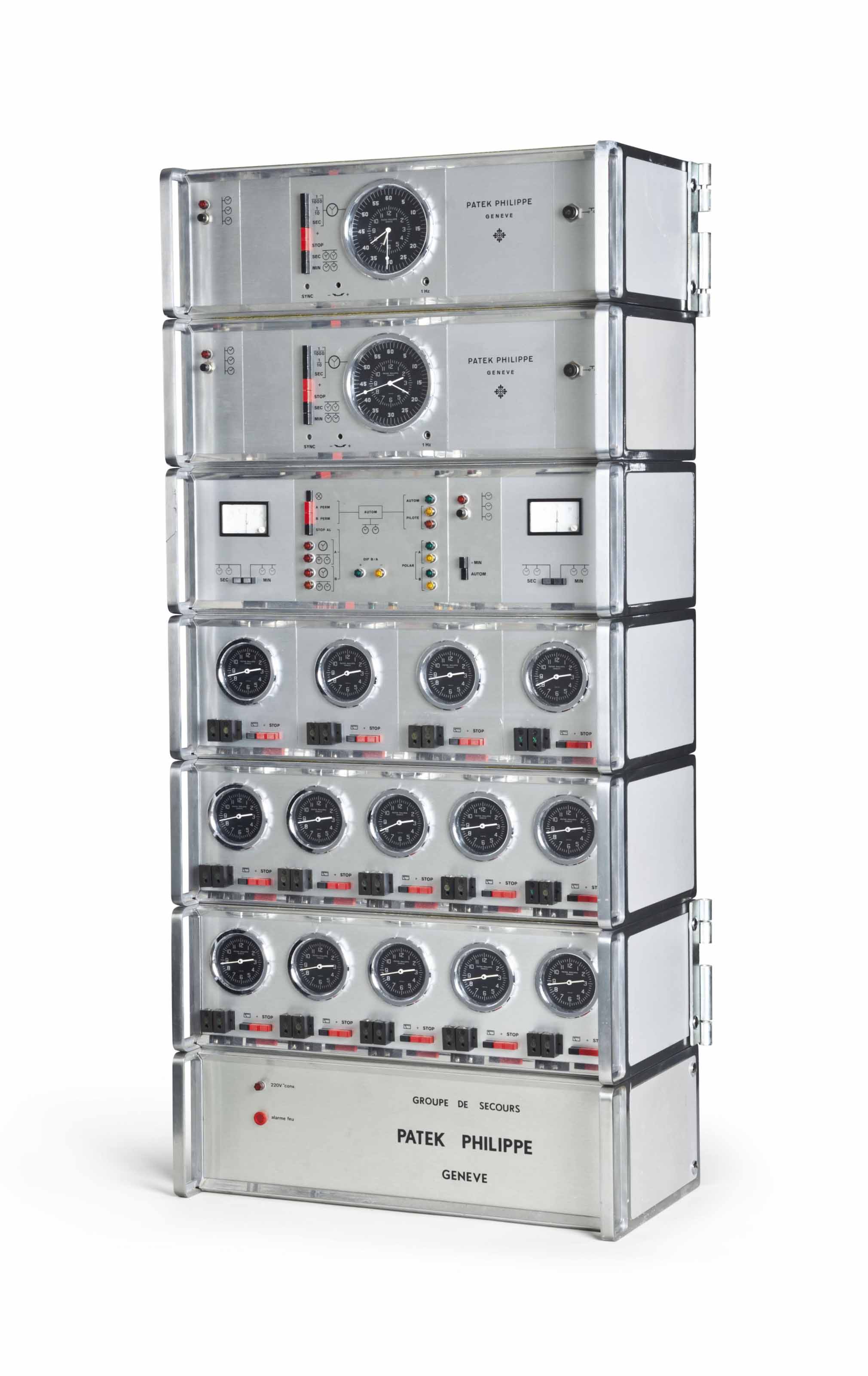 Patek Philippe. An Integrated Electronic Master Clock System with Seven Piece Rack Tower SIGNED PATEK PHILIPPE GENEVE MADE CIRCA 1975. Christie s