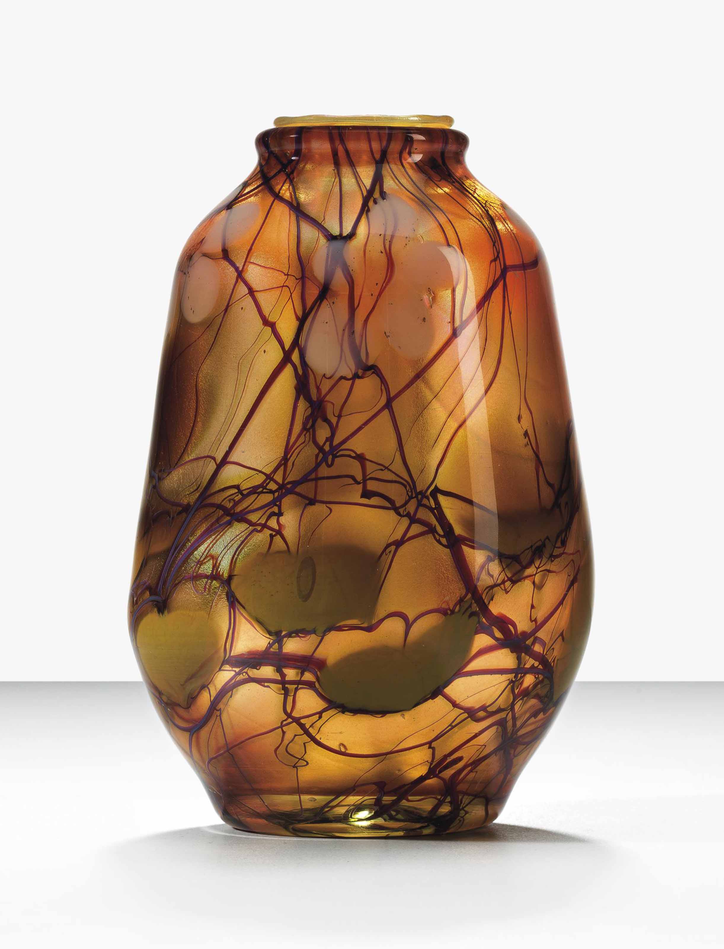 TIFFANY STUDIOS , A PAPERWEIGHT VASE, CIRCA 1910 Christie's