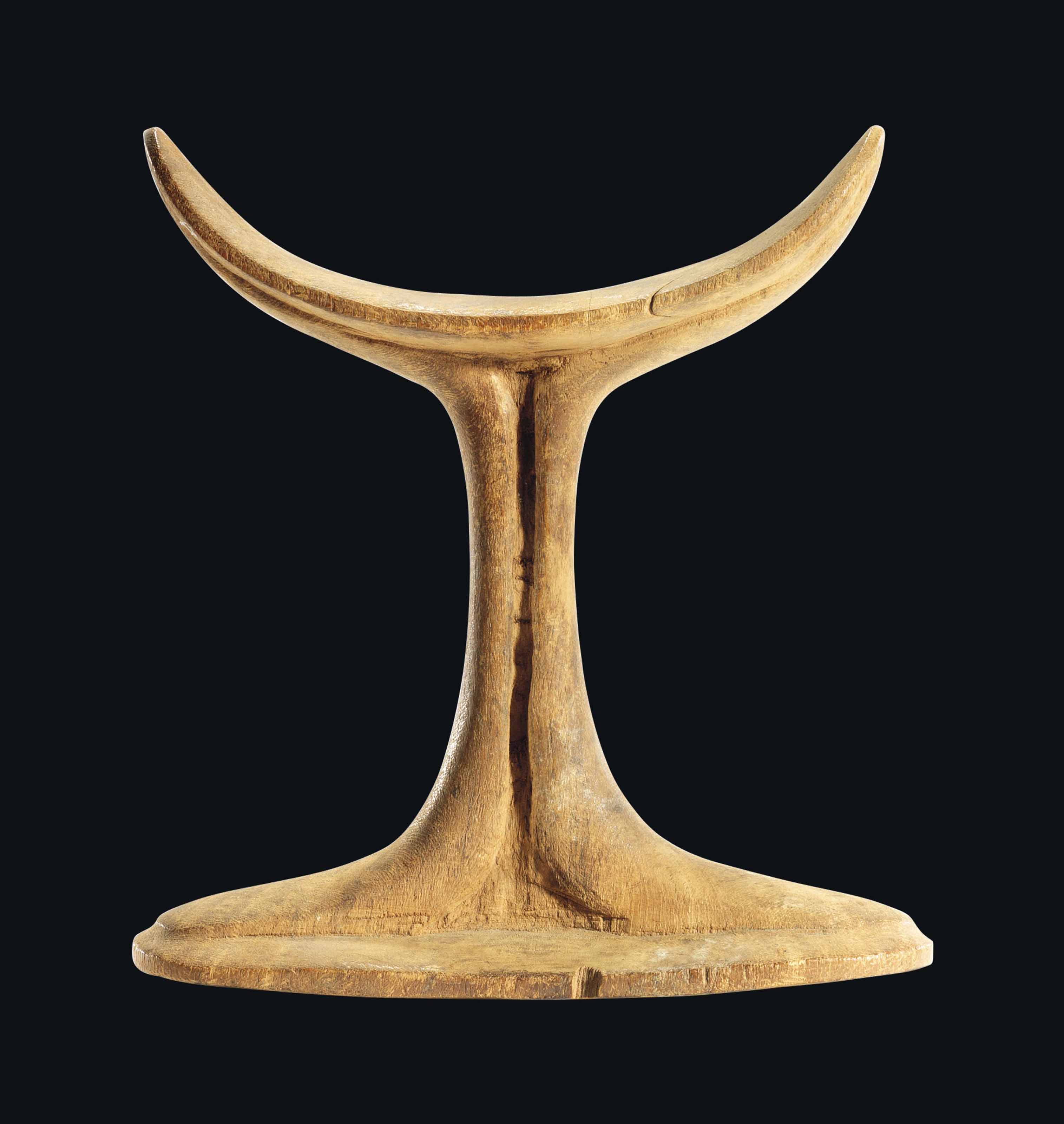 AN EGYPTIAN WOOD HEADREST , OLD KINGDOM, CIRCA 26862160 B.C. Christie's