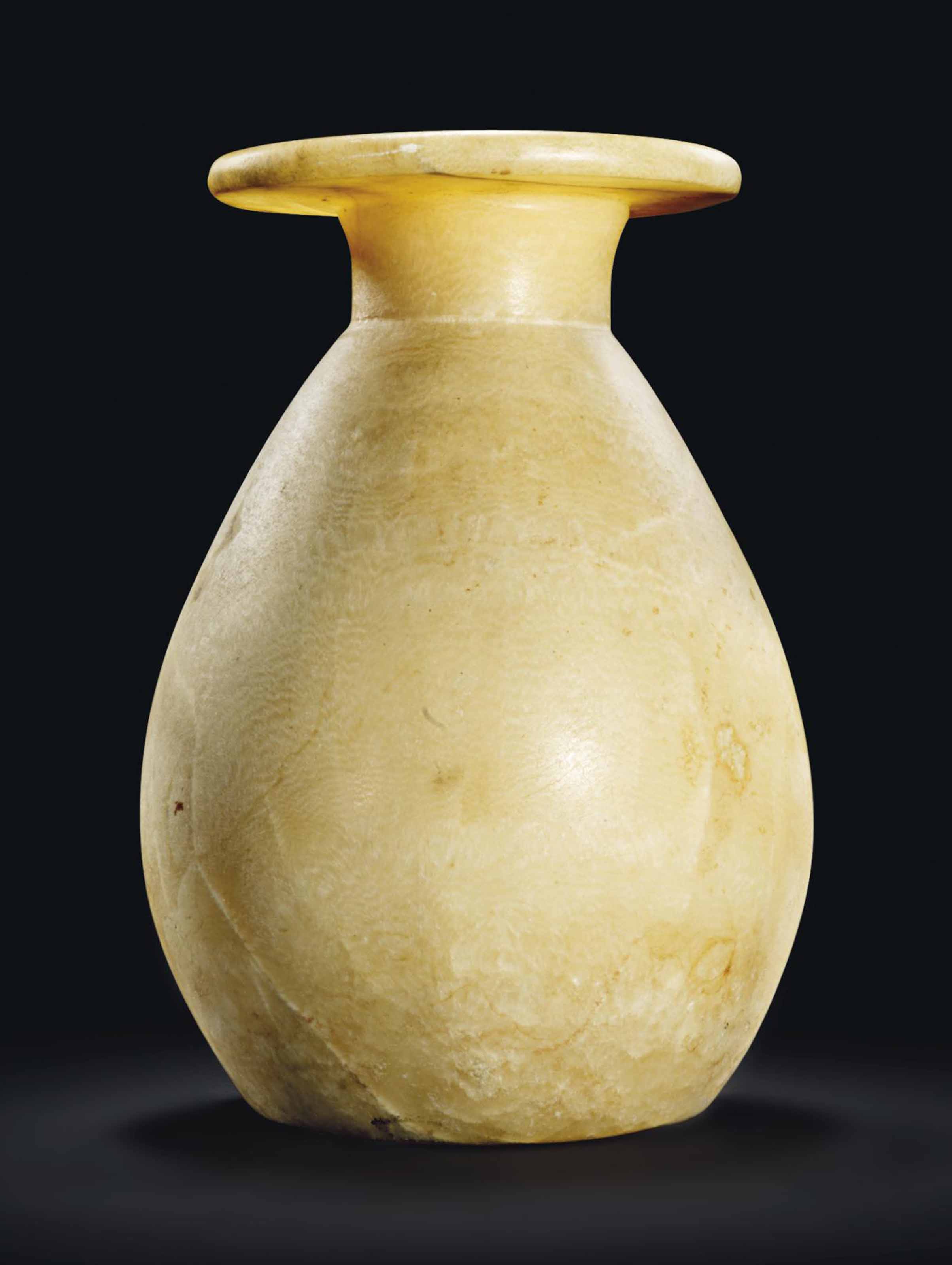 AN EGYPTIAN ALABASTER JAR , NEW KINGDOM, 18TH20TH DYNASTY, CIRCA 1550