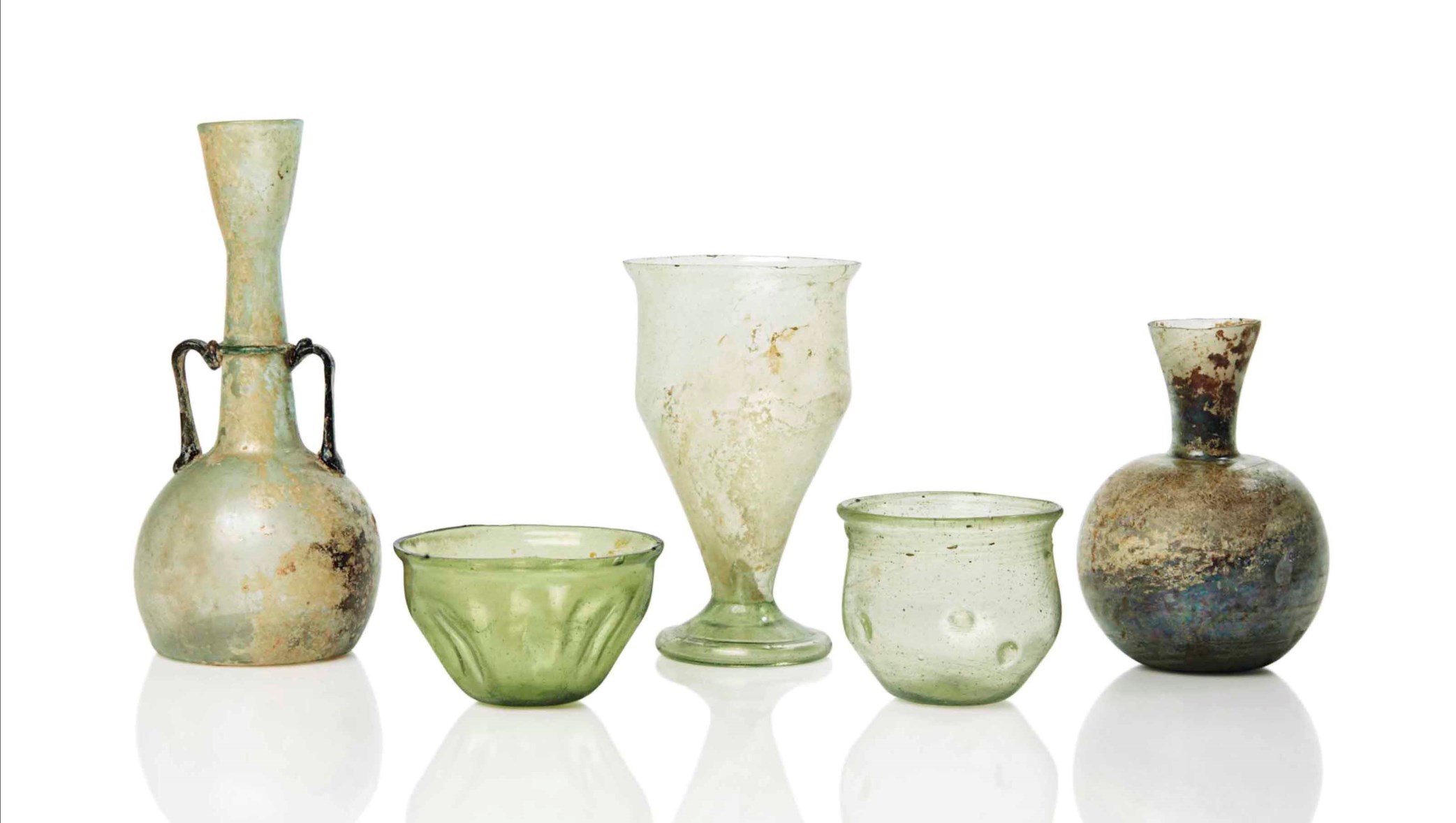 FIVE ROMAN GLASS VESSELS