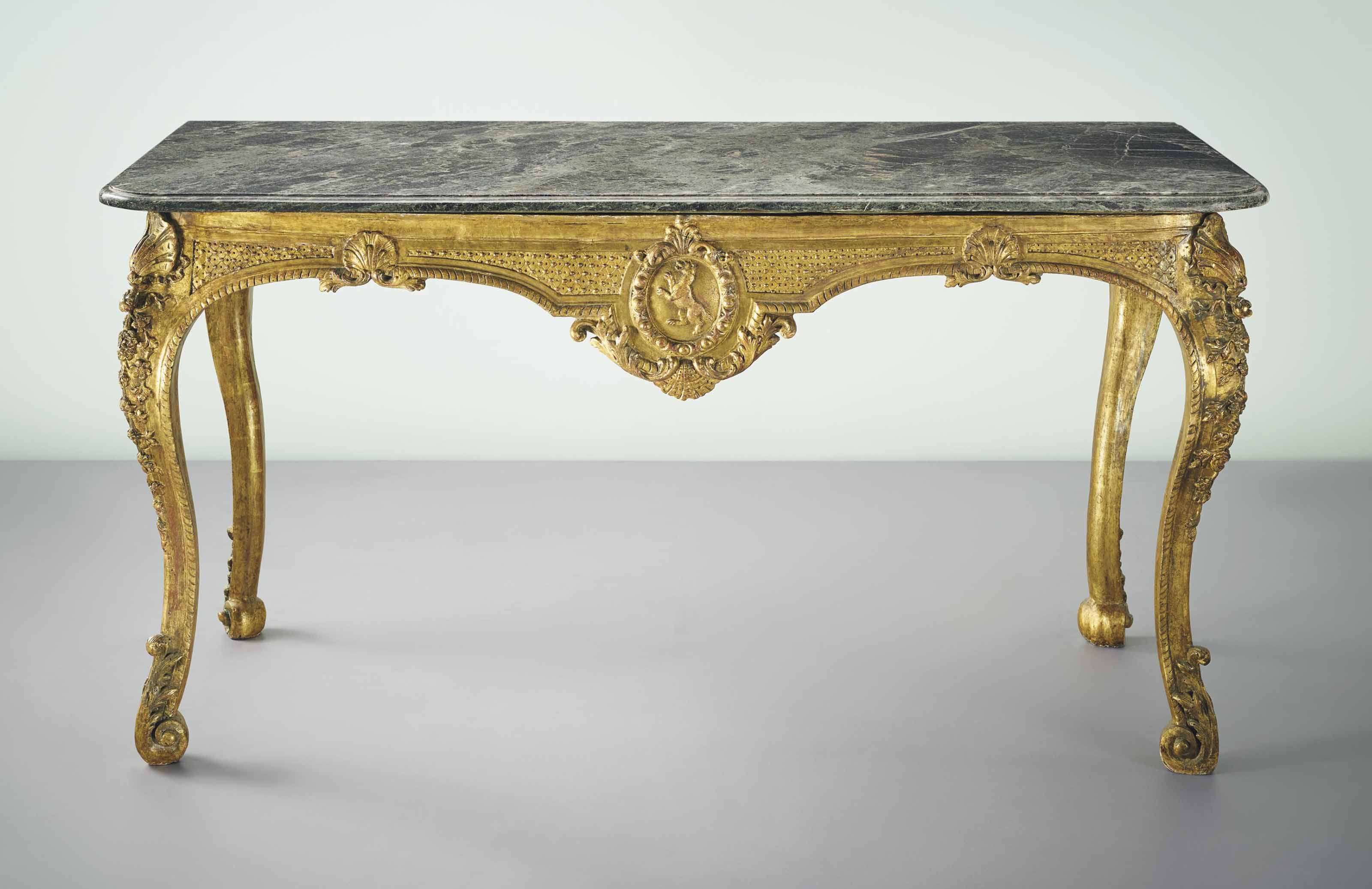 AN EARLY LOUIS XV GILTWOOD SIDE TABLE