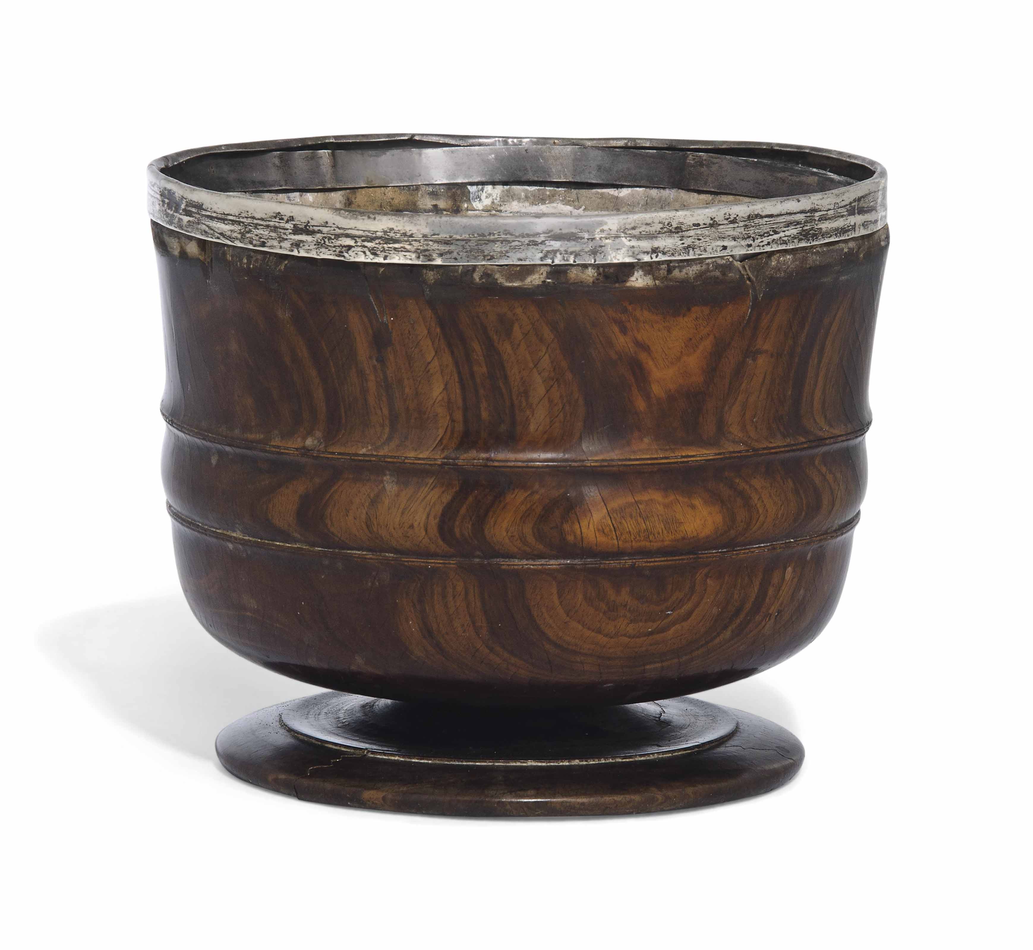 A CHARLES II LIGNUM VITAE WASSAIL BOWL , CIRCA 1680 Christie's