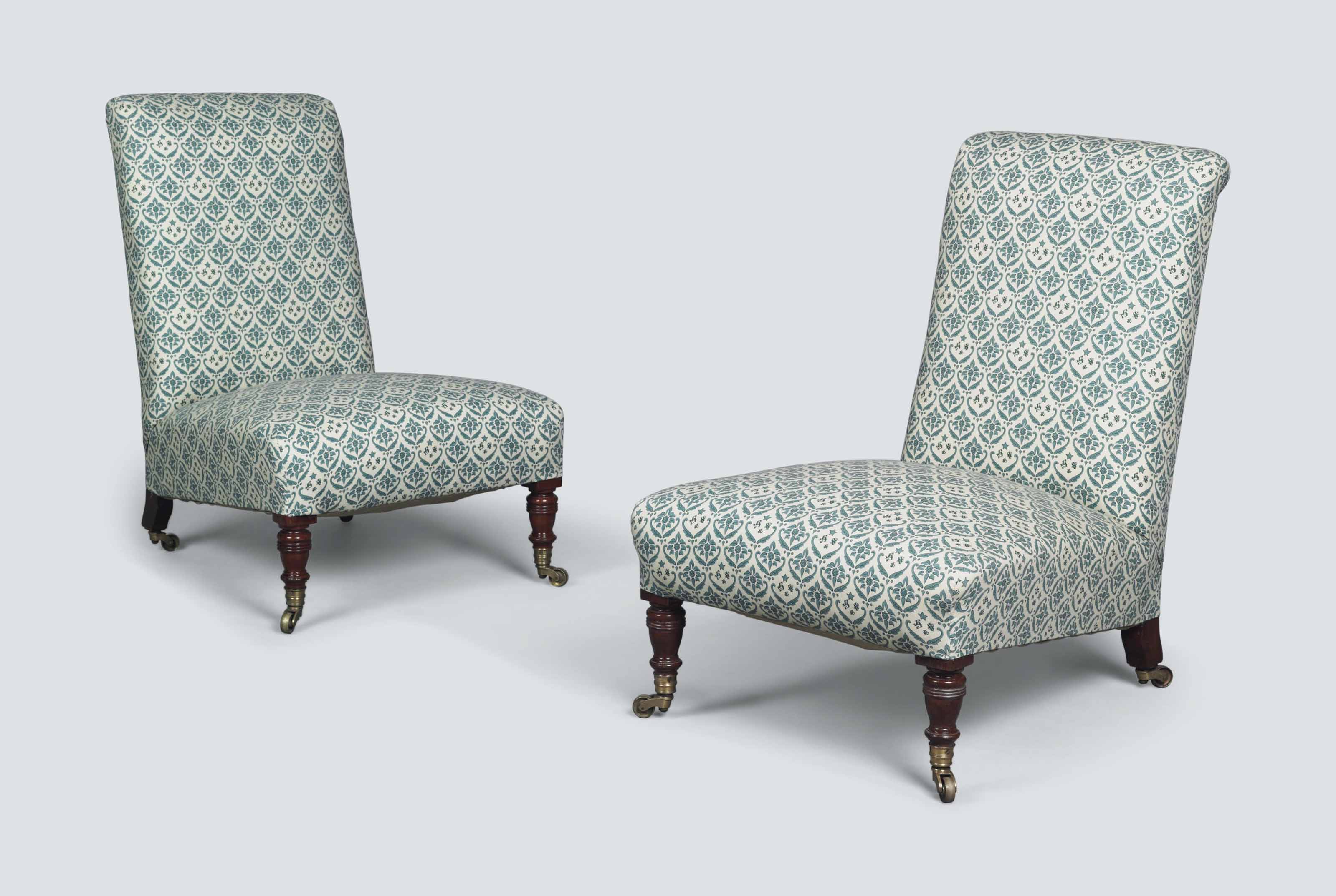 A PAIR OF VICTORIAN WALNUT LOW CHAIRS