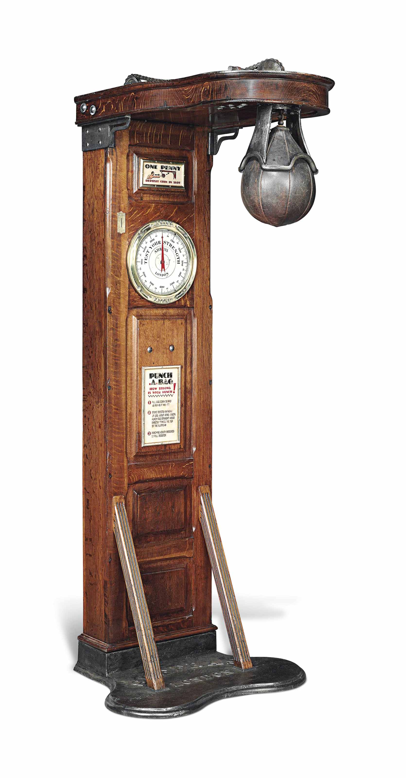 A BRASSMOUNTED OAK 'TEST YOUR STRENGTH' PUNCH BAG MACHINE , CIRCA