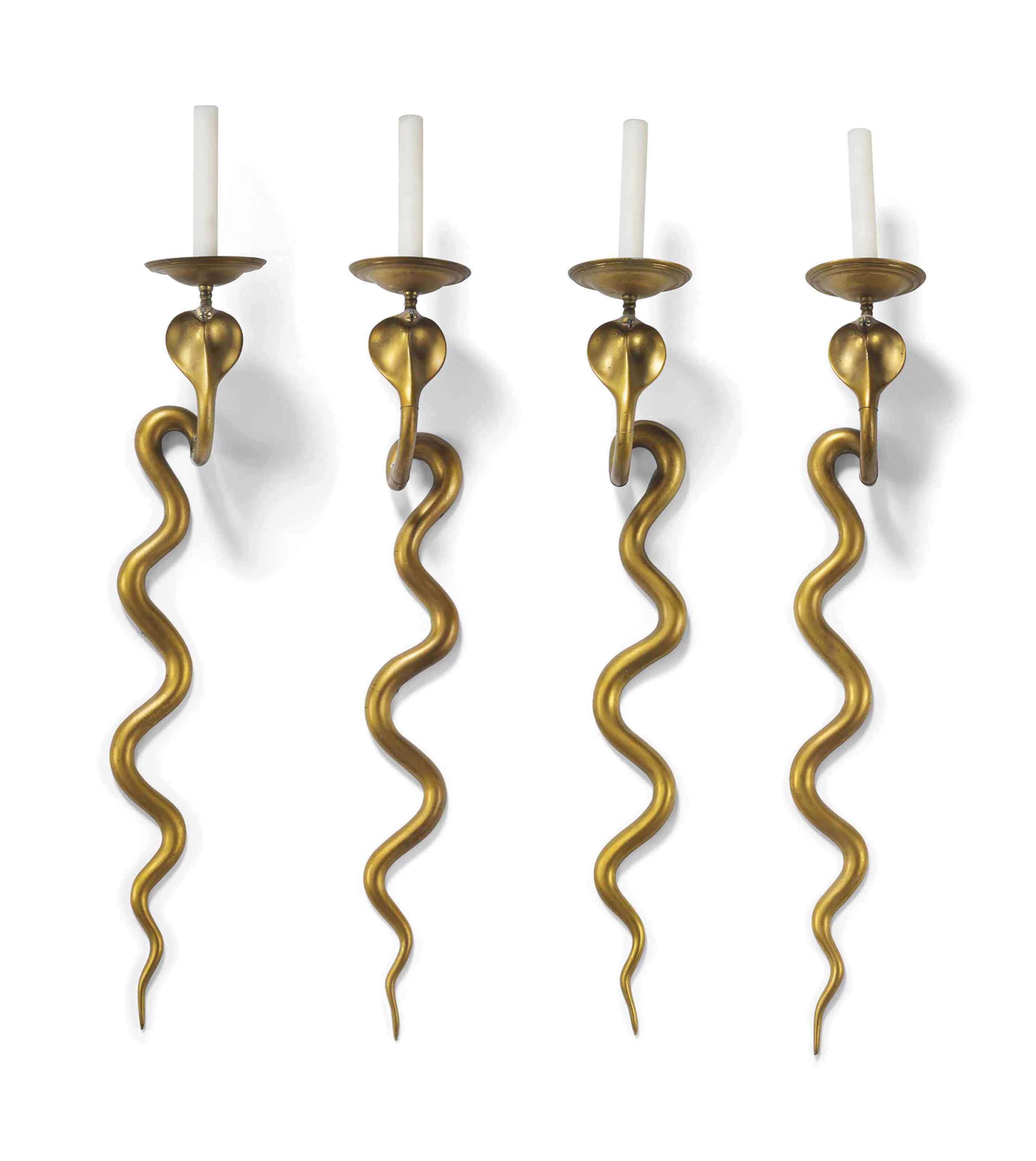 A SET OF TEN LACQUERED BRASS WALL APPLIQUES , 20TH CENTURY Christie's