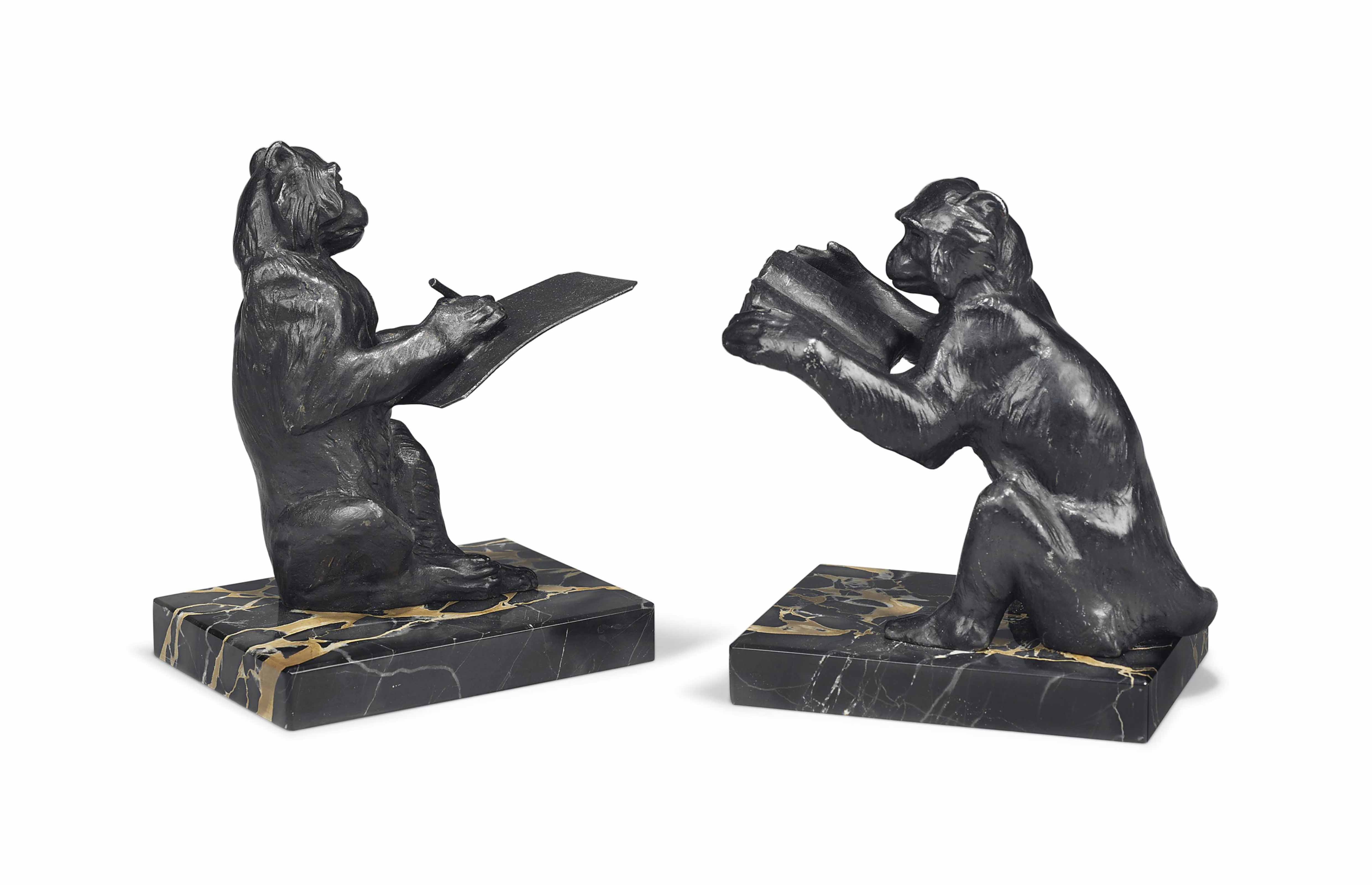 deco red enamel spelter on marble bookends