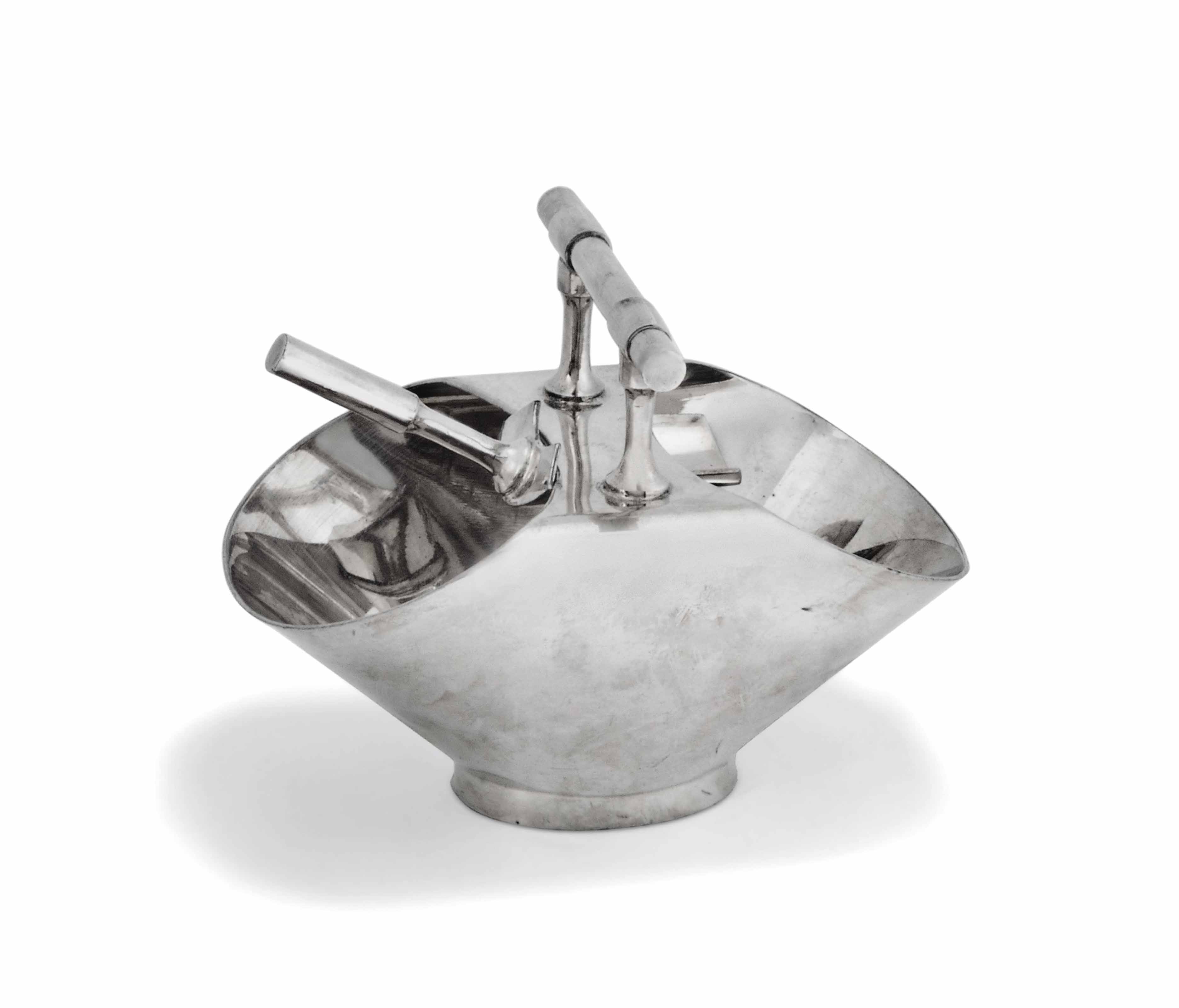 A Silver Plated Sugar Bowl And Shovel After A Design By