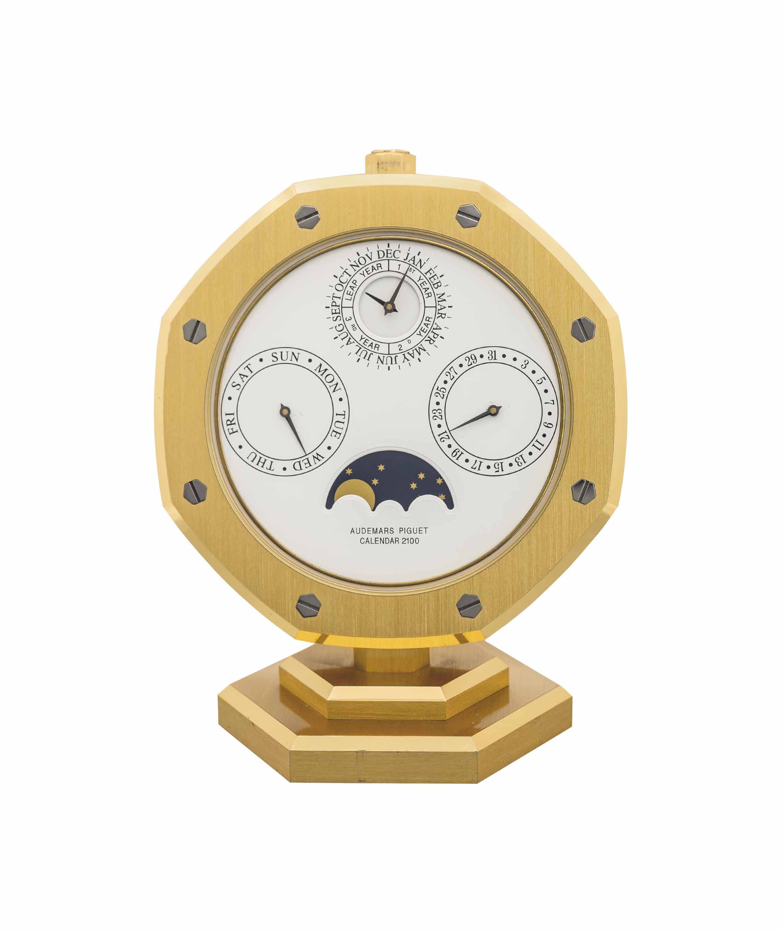 audemars-piguet-a-gilt-brass-perpetual-calendar-desk-clock-signed