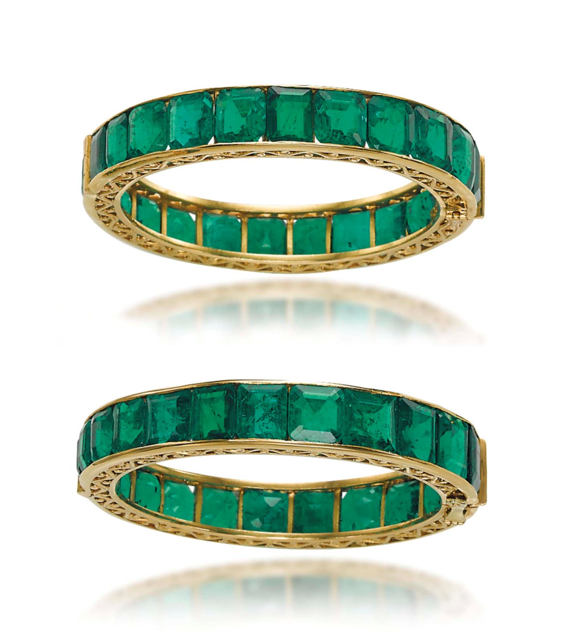 A SUPERB PAIR OF ANTIQUE EMERALD BANGLES | Christie's