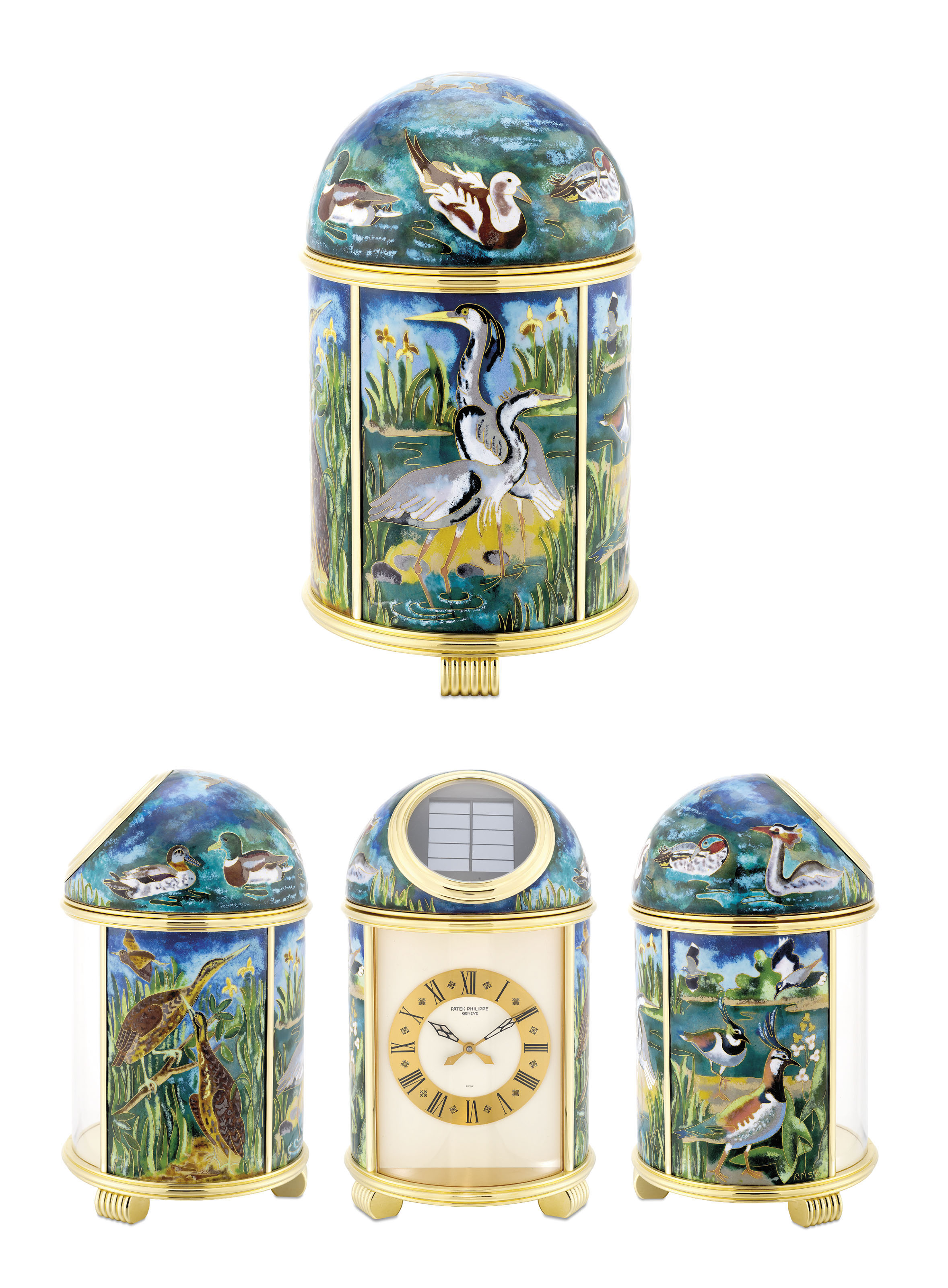 PATEK PHILIPPE. A VERY FINE AND UNIQUE GILT BRASS SOLARPOWERED DESK