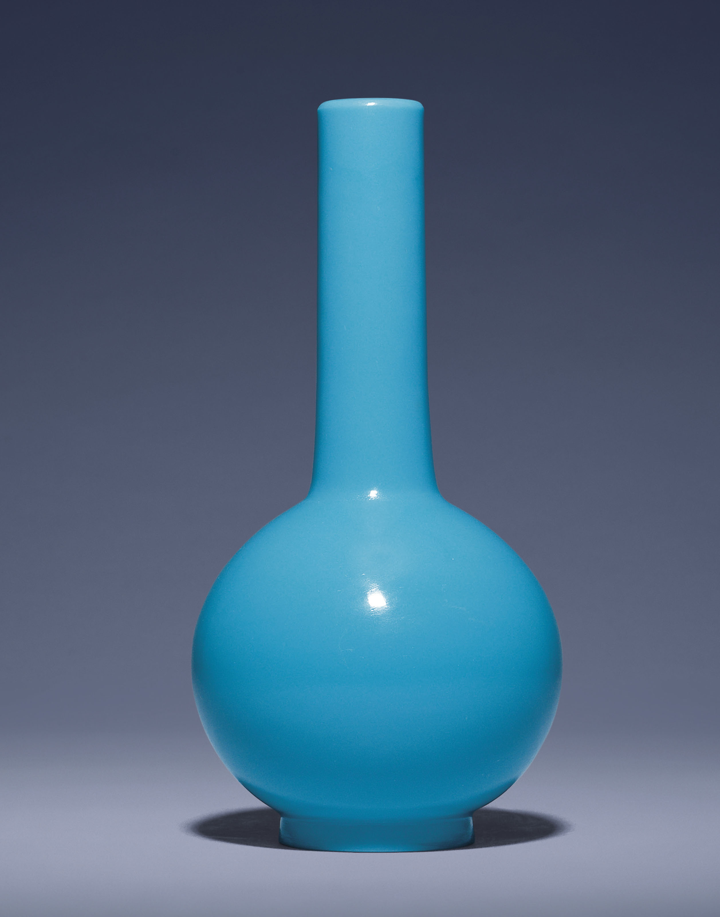 A BLUE GLASS BOTTLE VASE , QIANLONG INCISED FOURCHARACTER MARK WITHIN