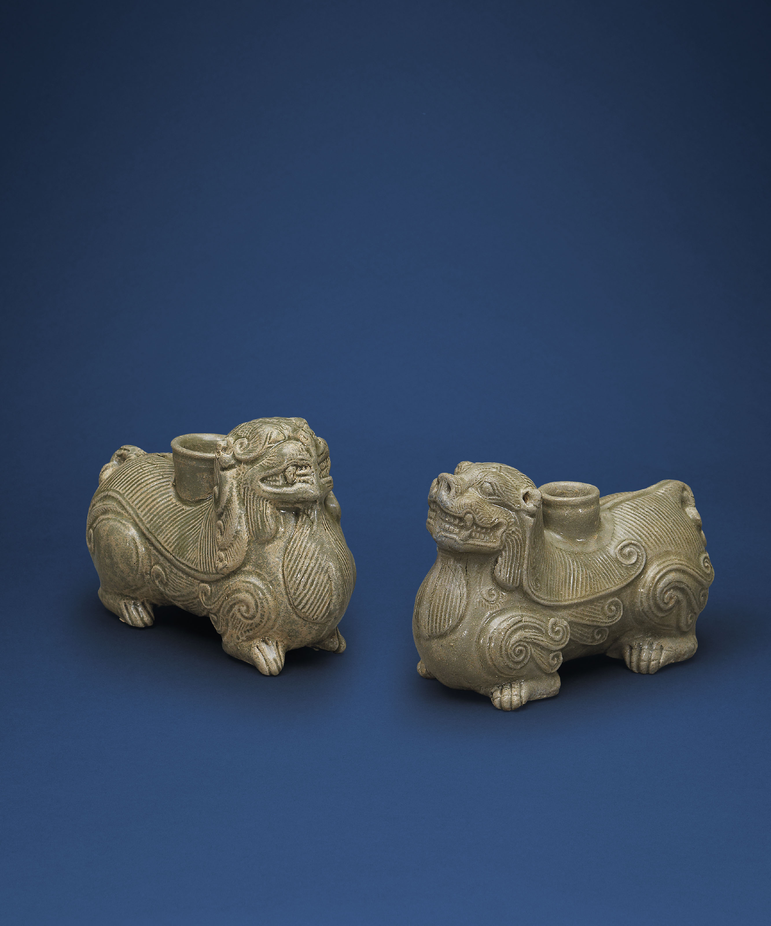 TWO YUE CELADON MYTHICAL BEASTFORM HOLDERS , WESTERN JIN DYNASTY (265