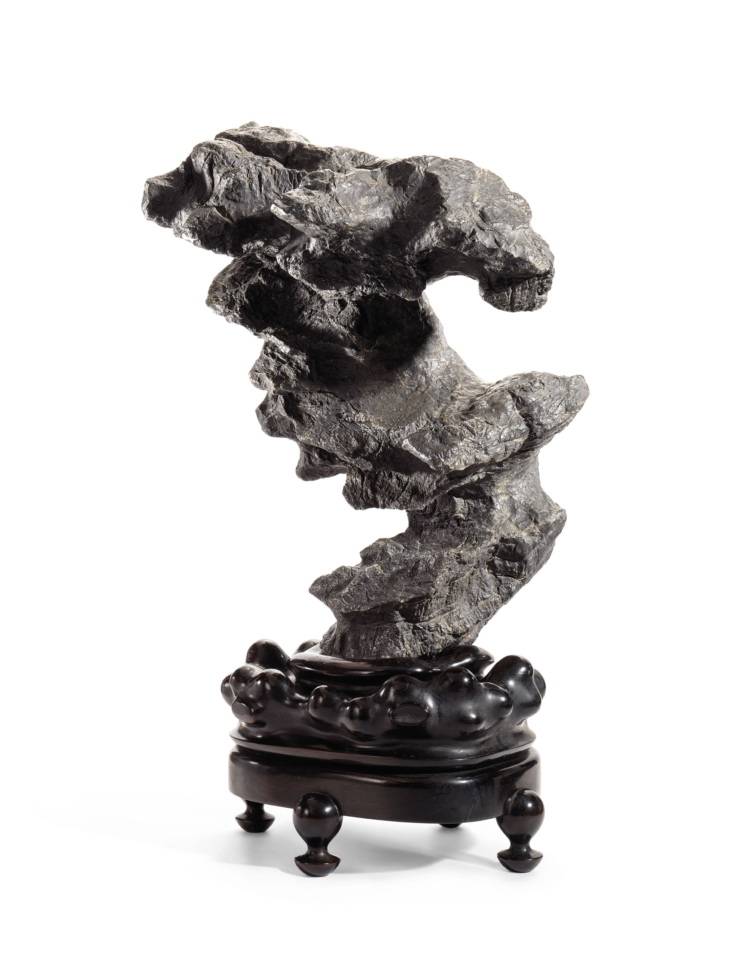 An inscribed and dated Lingbi cloud-form scholar's rock, sold for HK$2,200,000 on 2 December 2015 at Christie's in Hong Kong