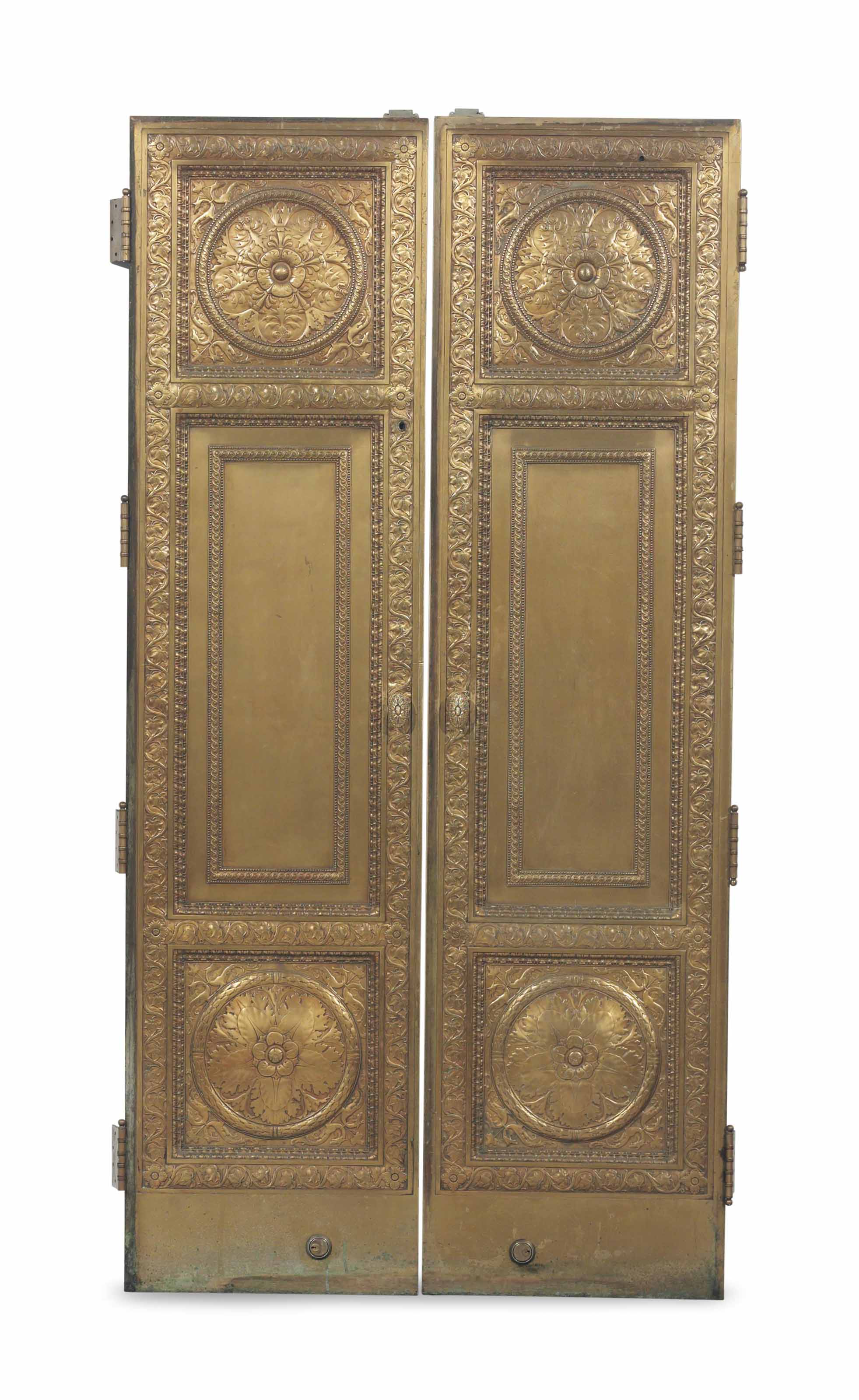 A PAIR OF DECORATIVE BRASS DOORS,