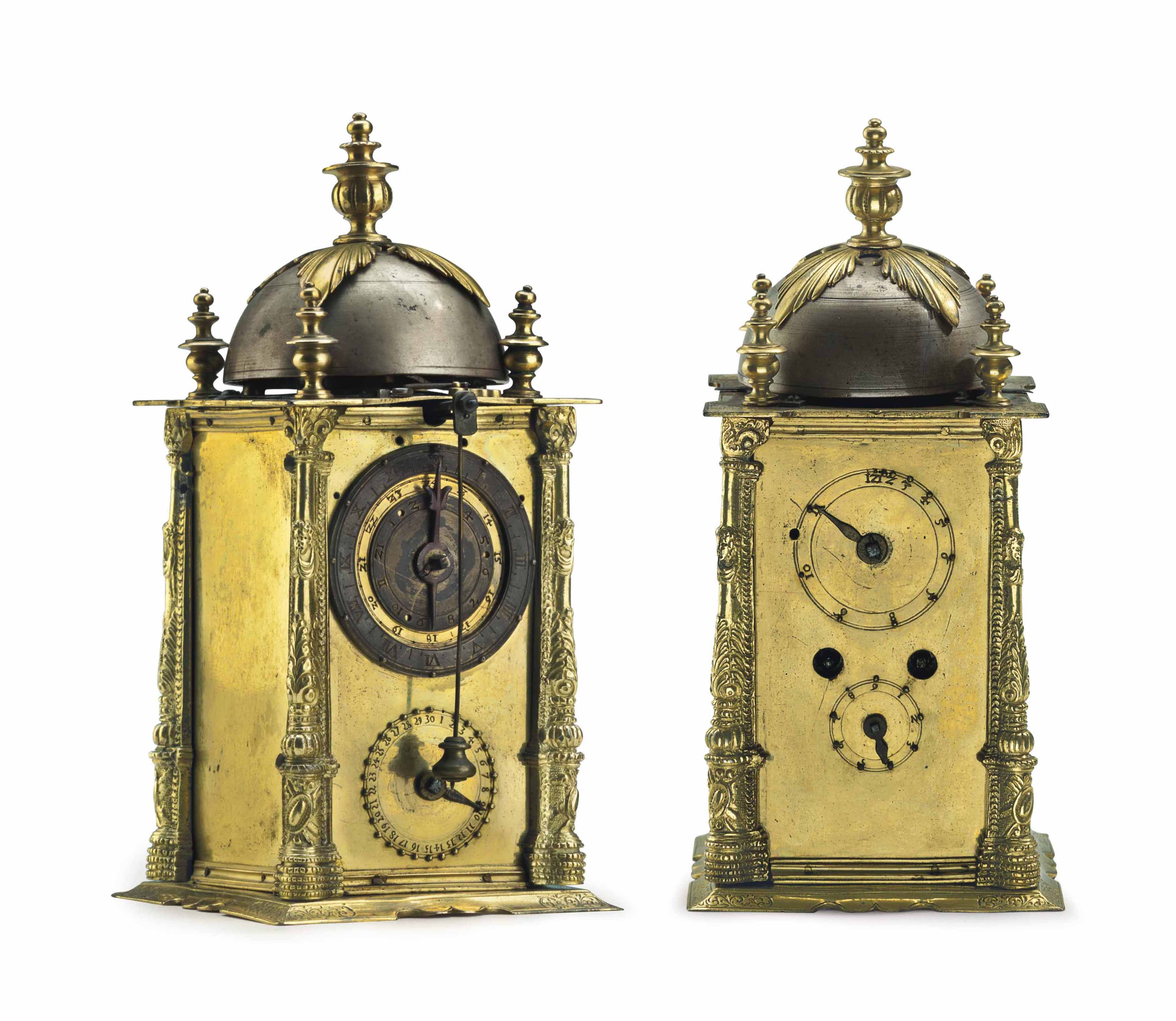 A GERMAN ENGRAVED GILTBRASS STRIKING TABLE CLOCK OF SMALL SIZE WITH ALARM