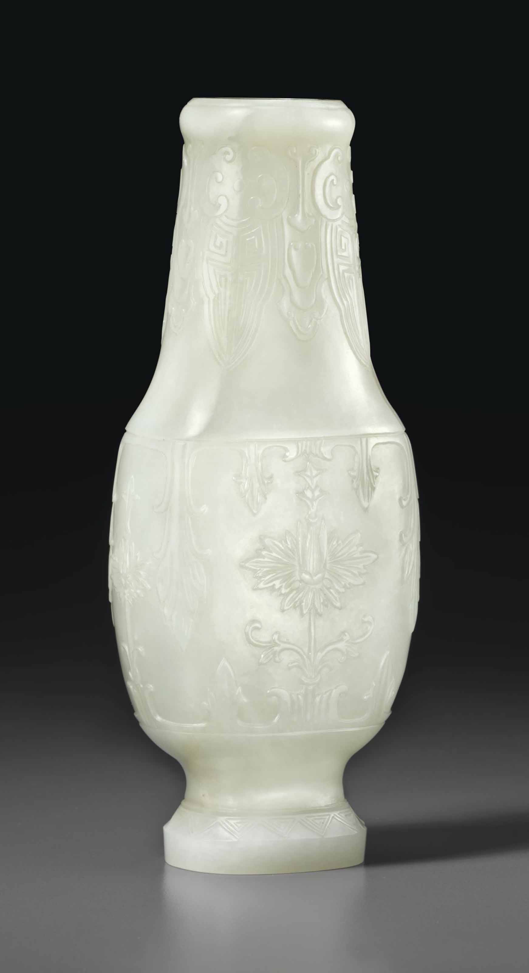 A MUGHALSTYLE PALE GREENISHWHITE JADE VASE , QIANLONG PERIOD (1736