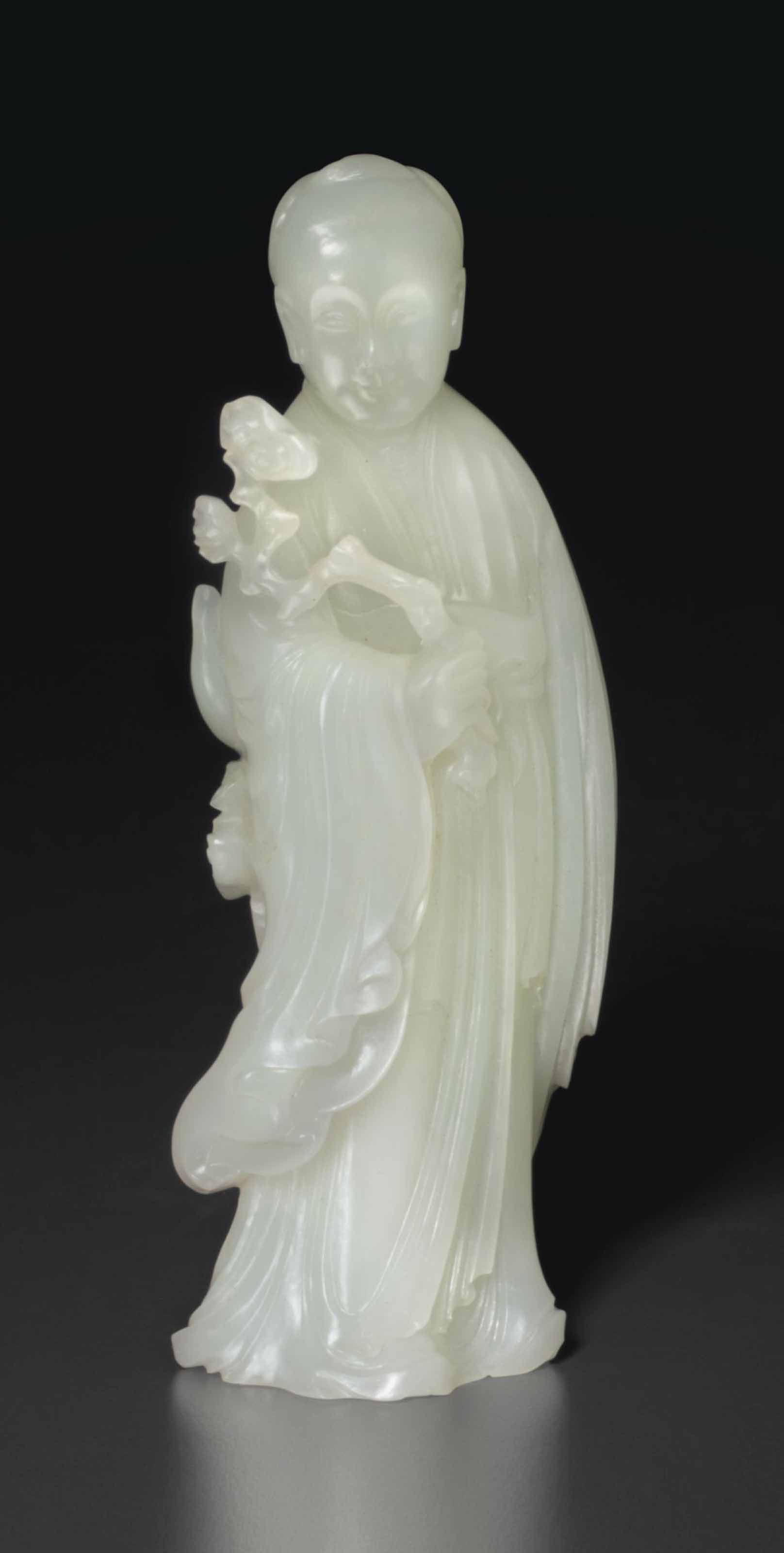 A WHITE JADE FIGURE OF A FEMALE IMMORTAL
