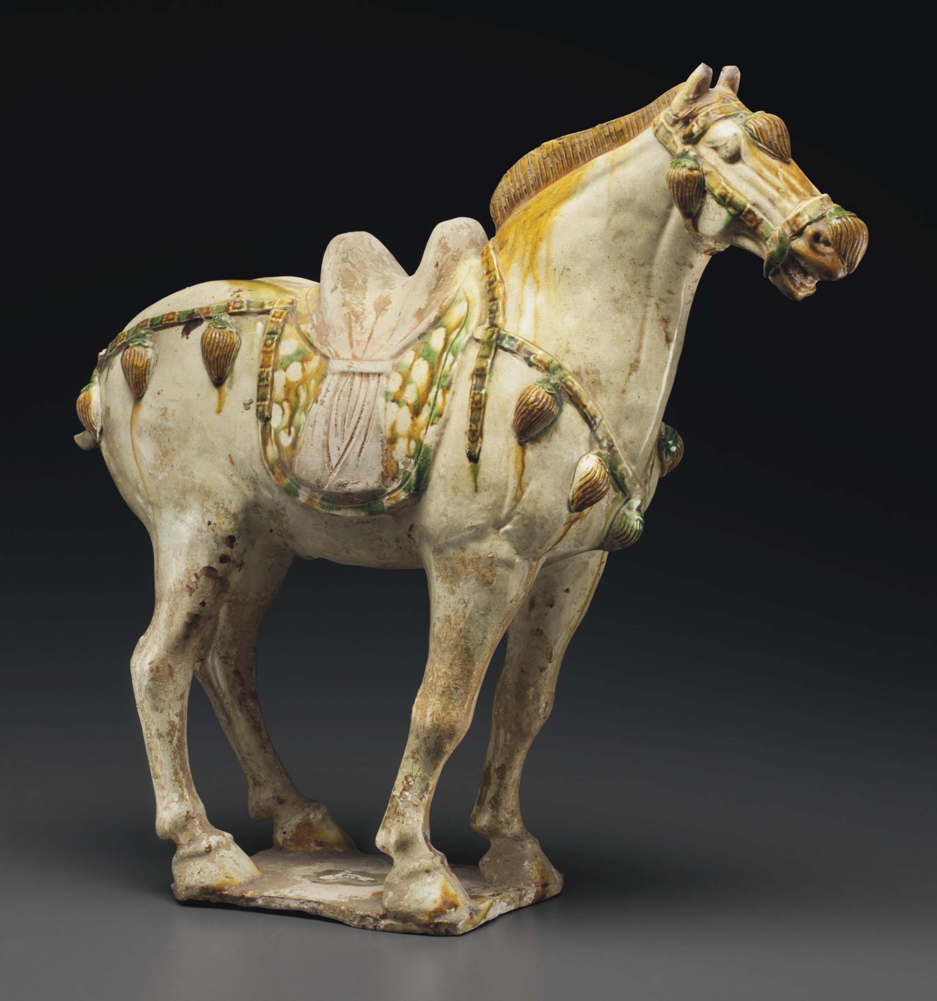 A SANCAIGLAZED POTTERY FIGURE OF A HORSE , TANG DYNASTY (AD 618907