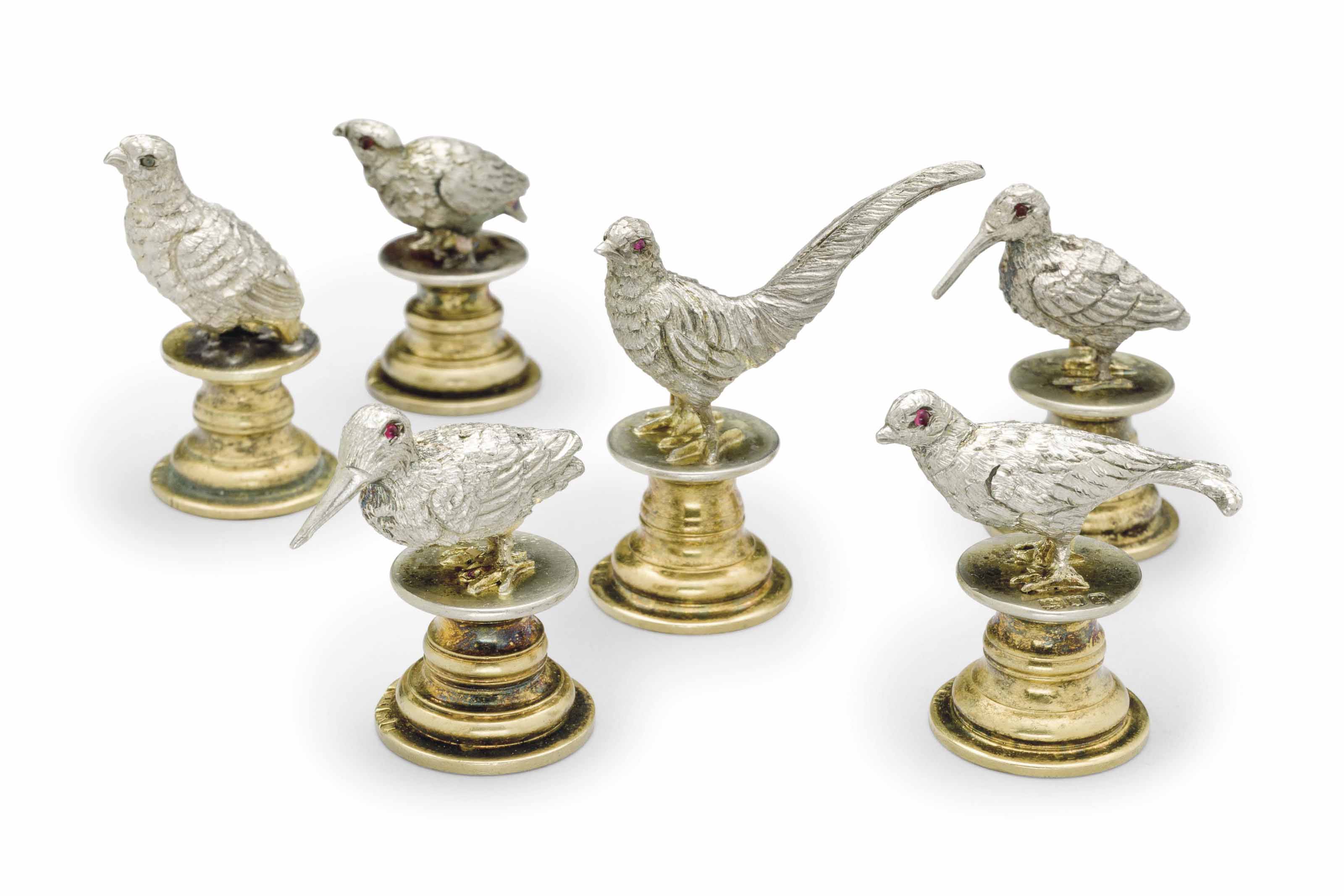 A SET OF SIX EDWARD VII SILVER AND SILVERGILT GAME BIRDFORM PLACE