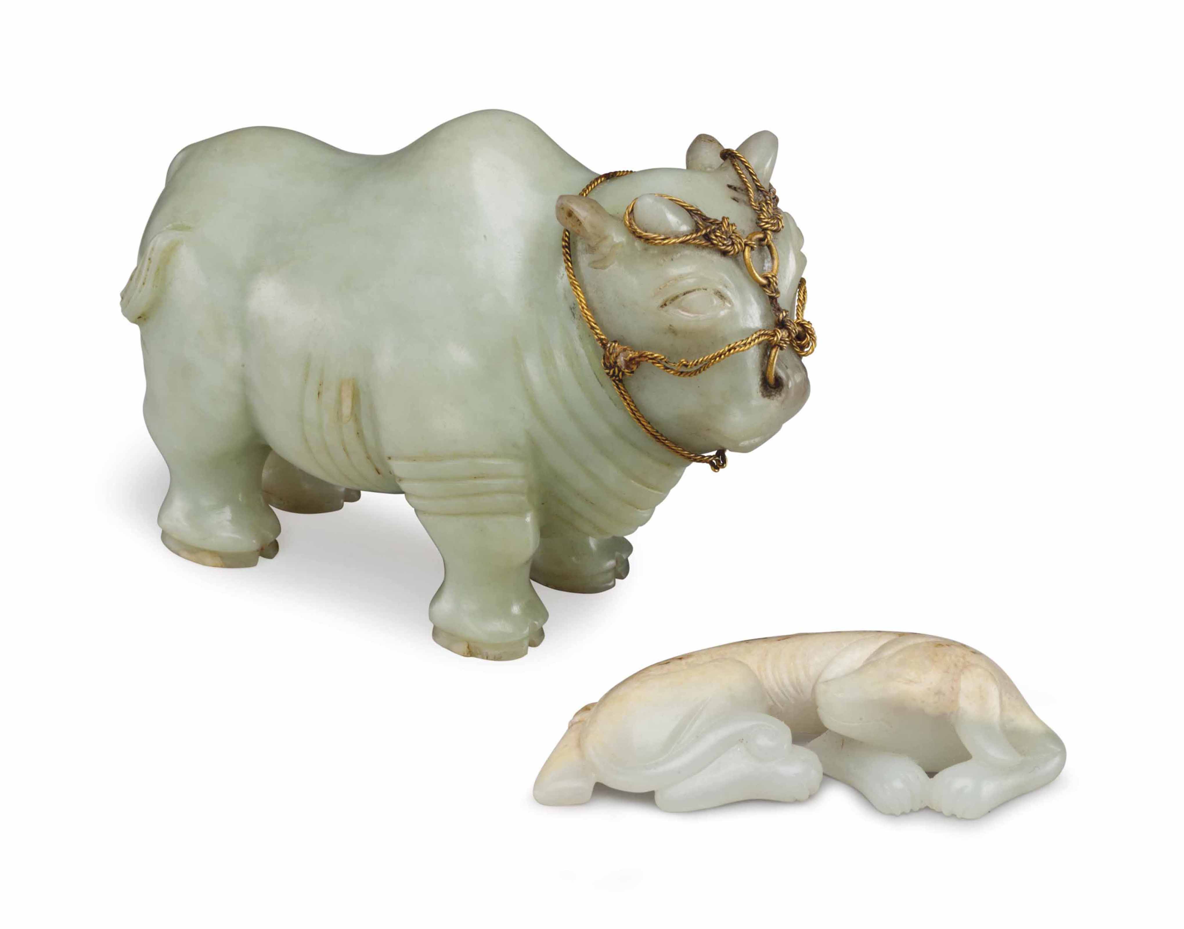 TWO CHINESE CARVED JADE FIGURES , MODERN Christie's