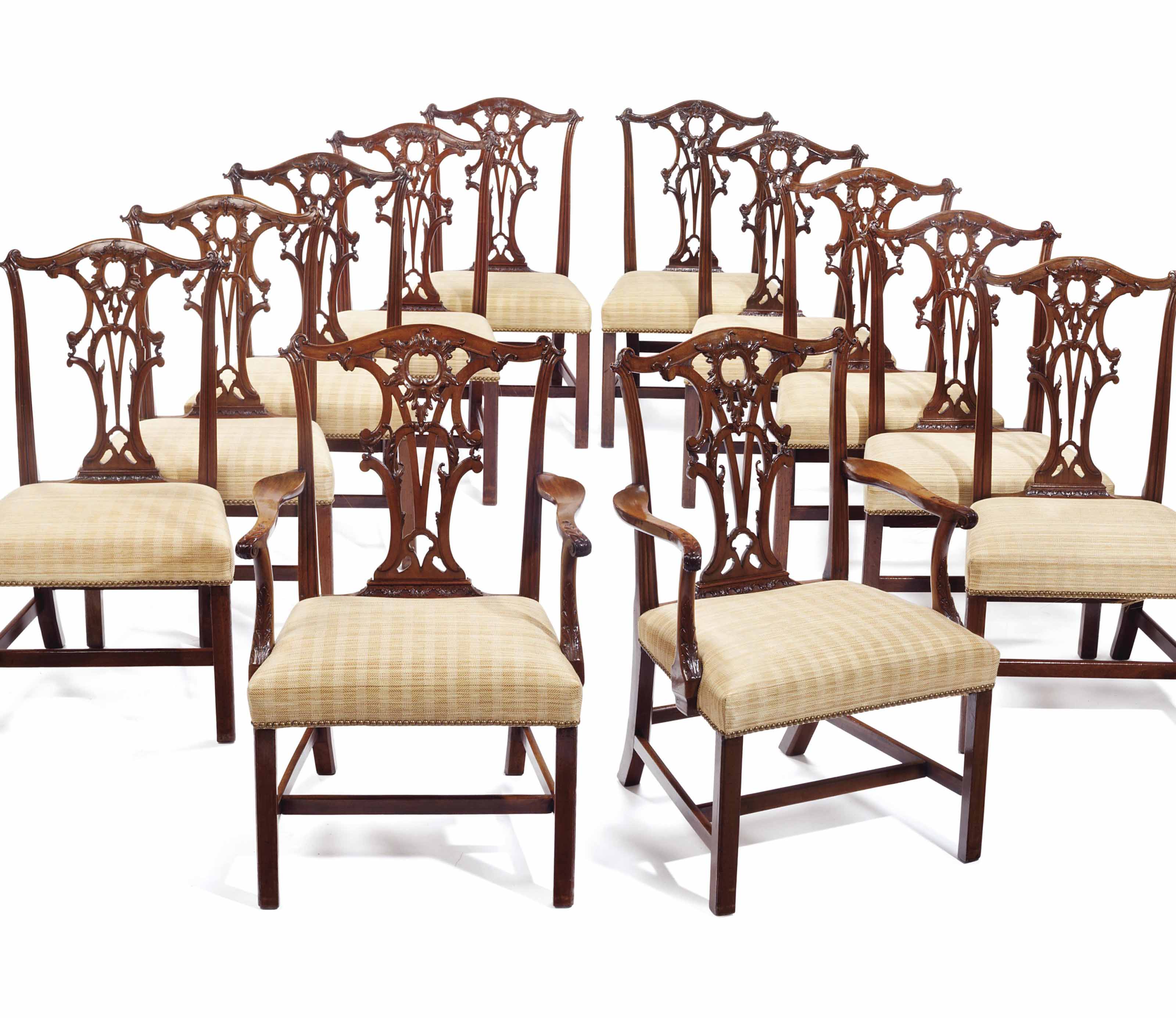 A SET OF TWELVE ENGLISH MAHOGANY DINING CHAIRS