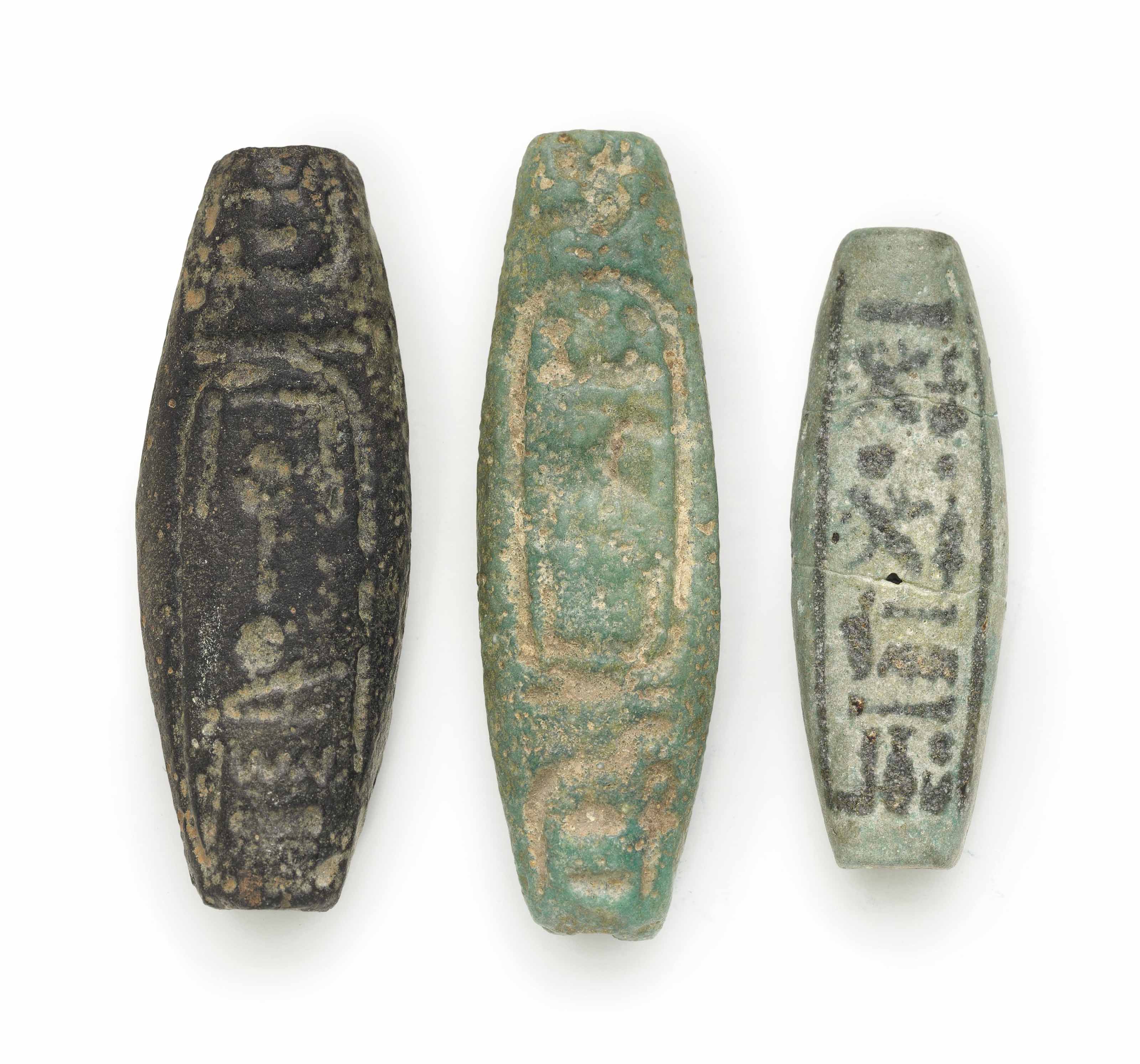 THREE EGYPTIAN INSCRIBED FAIENCE BEADS