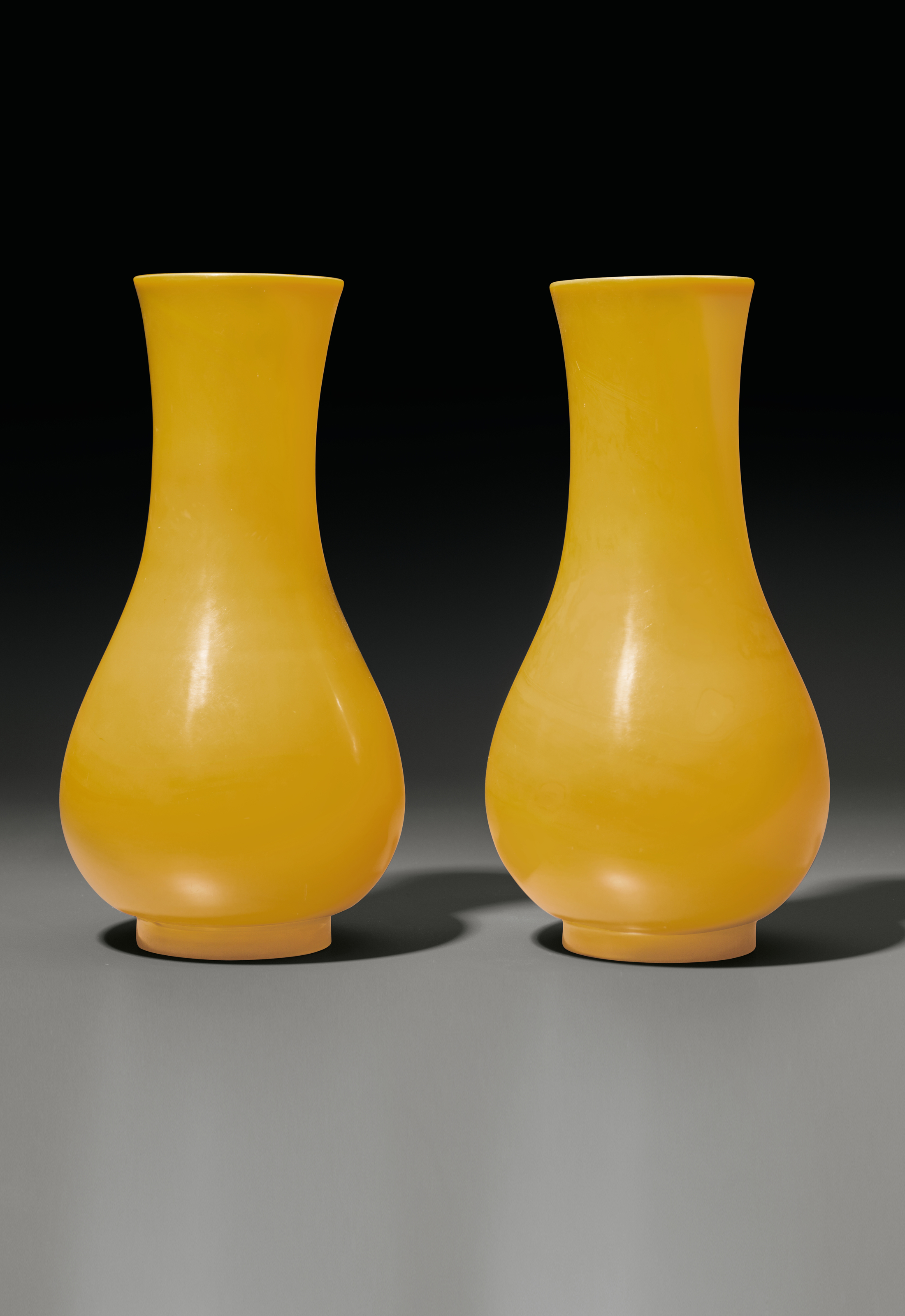 A PAIR OF EGGYOLK YELLOW GLASS PEARSHAPED VASES, CHINA, QING DYNASTY