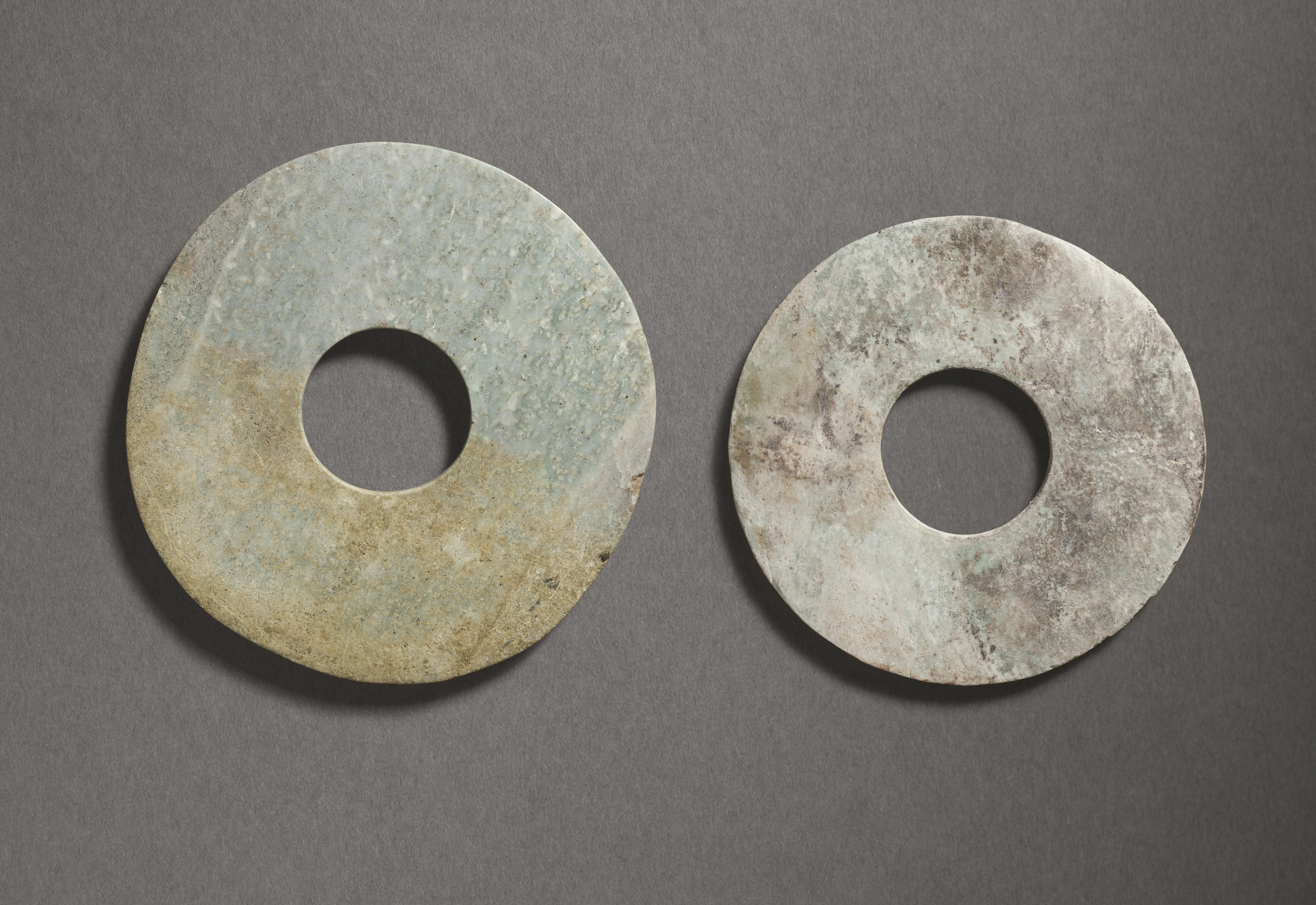 TWO STONE BI DISCS, CHINA, NEOLITHIC PERIOD, 3RD-2ND MILLENNIUM BC ...