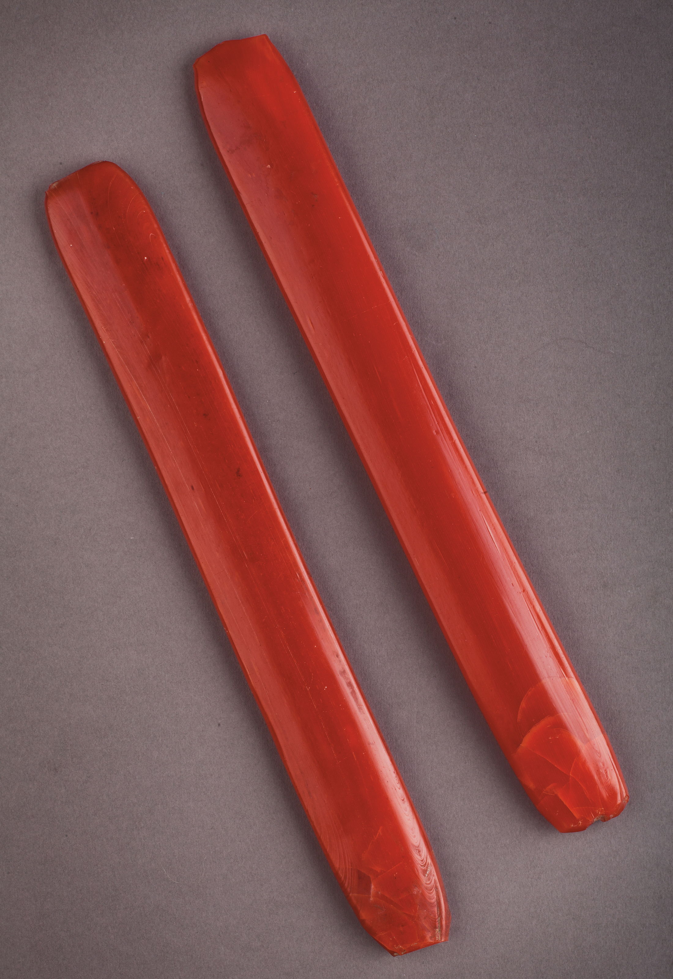 TWO CARNELIAN-RED GLASS RODS, CHINA, QING DYNASTY OR LATER | Christie’s
