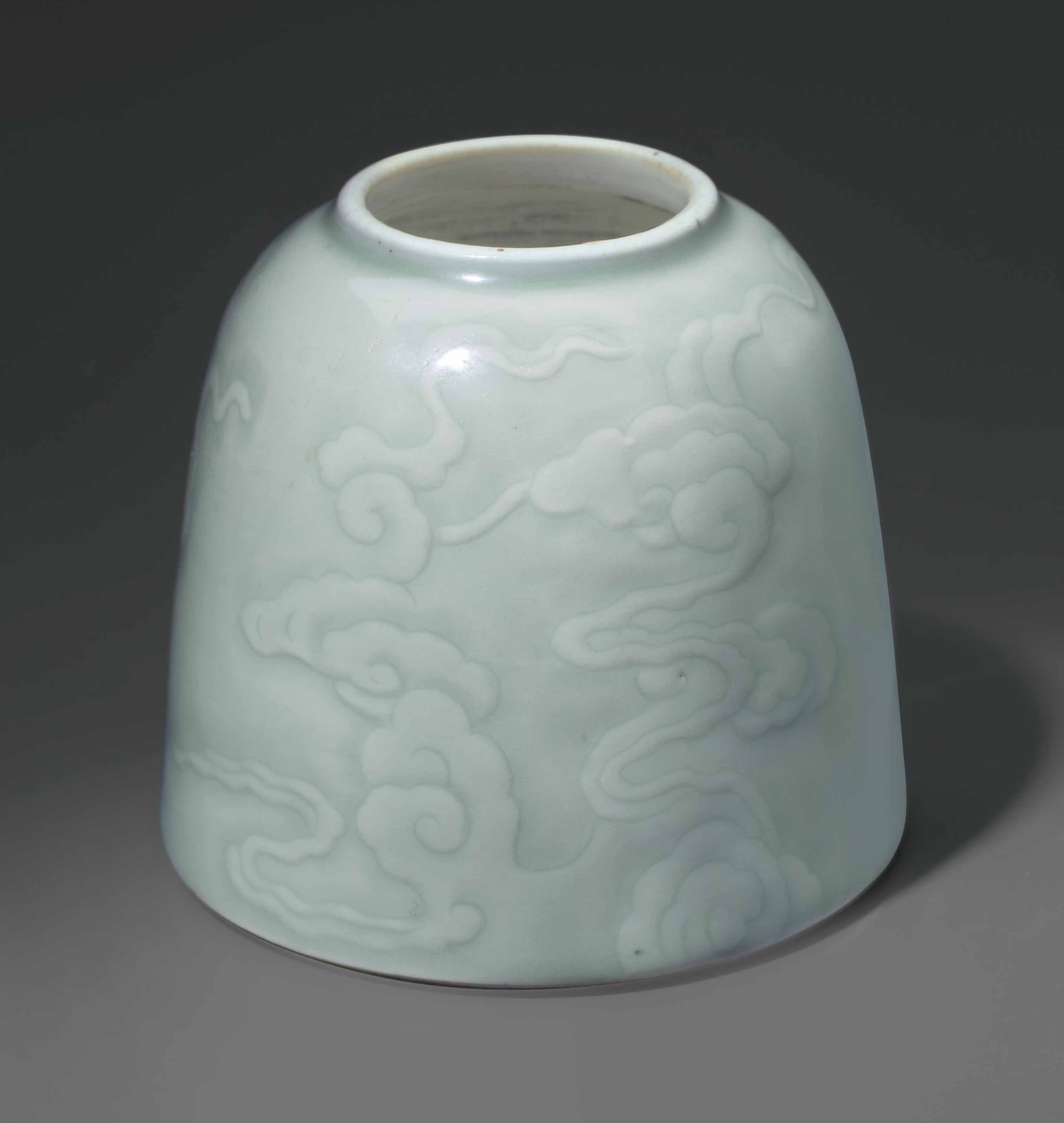 A CELADON-GLAZED CARVED DOMED WATER POT, CHINA, QING DYNASTY, 18TH