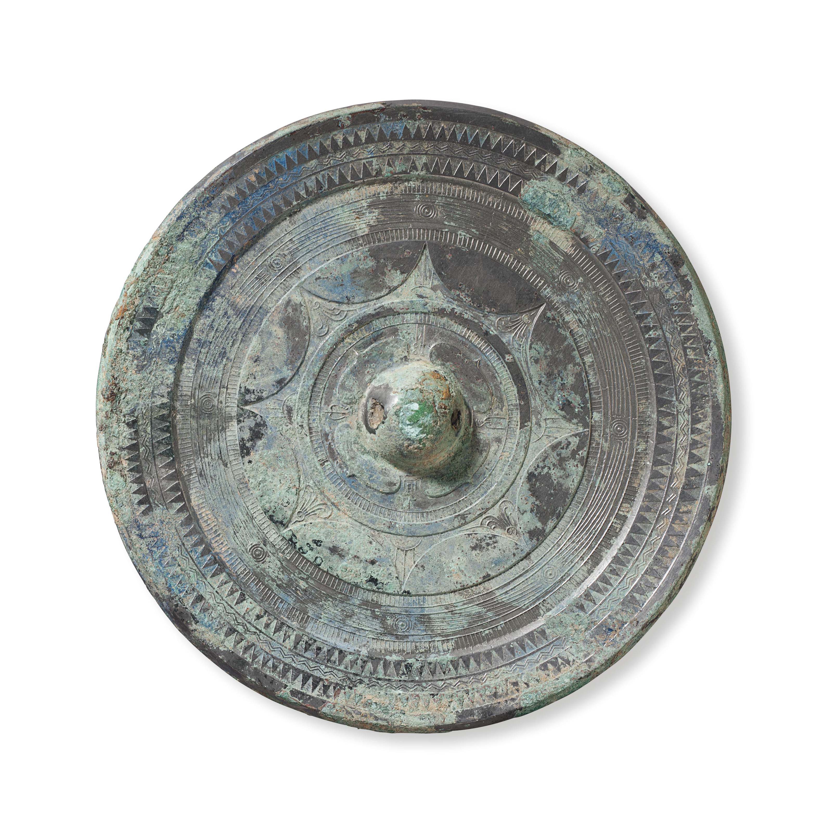 Image result for A silvery bronze circular mirror with joined arcs, China, Early Eastern Han dynasty, 1st century AD