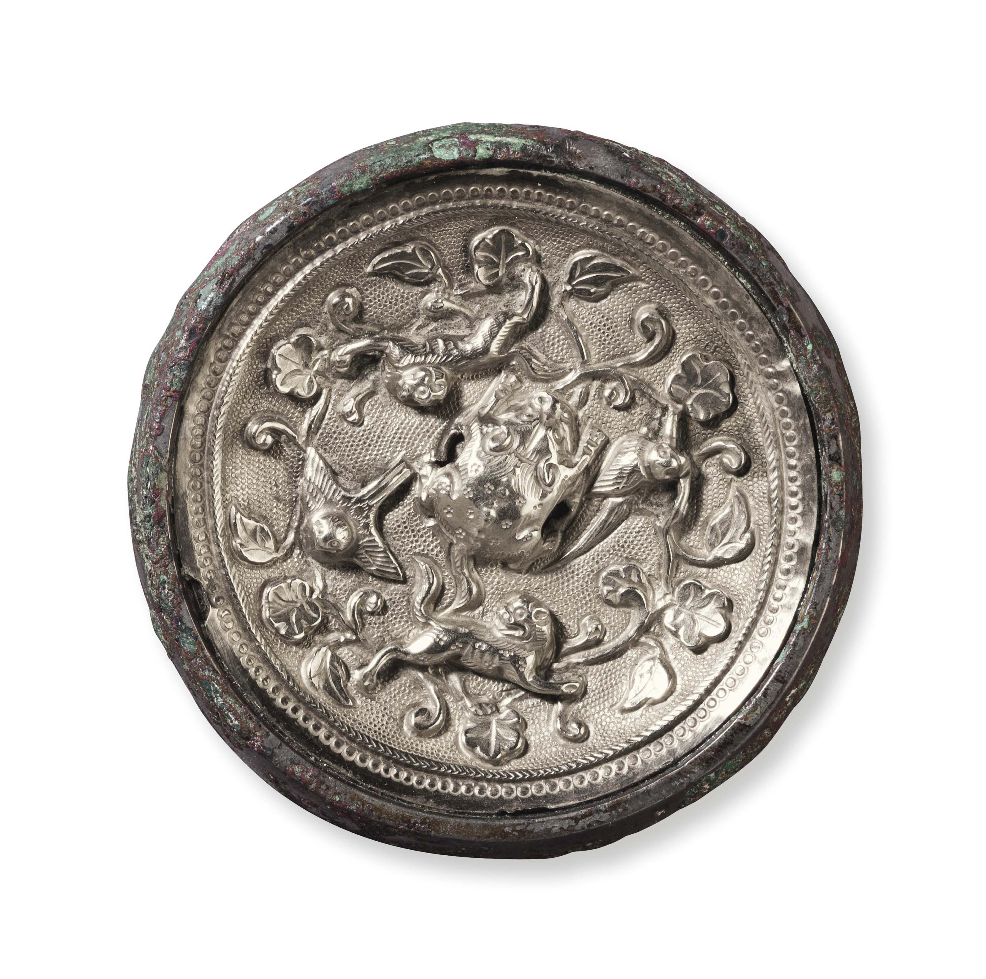 Image result for A miniature silver sheet-inlaid bronze circular mirror, China, Tang dynasty (AD 618-907)