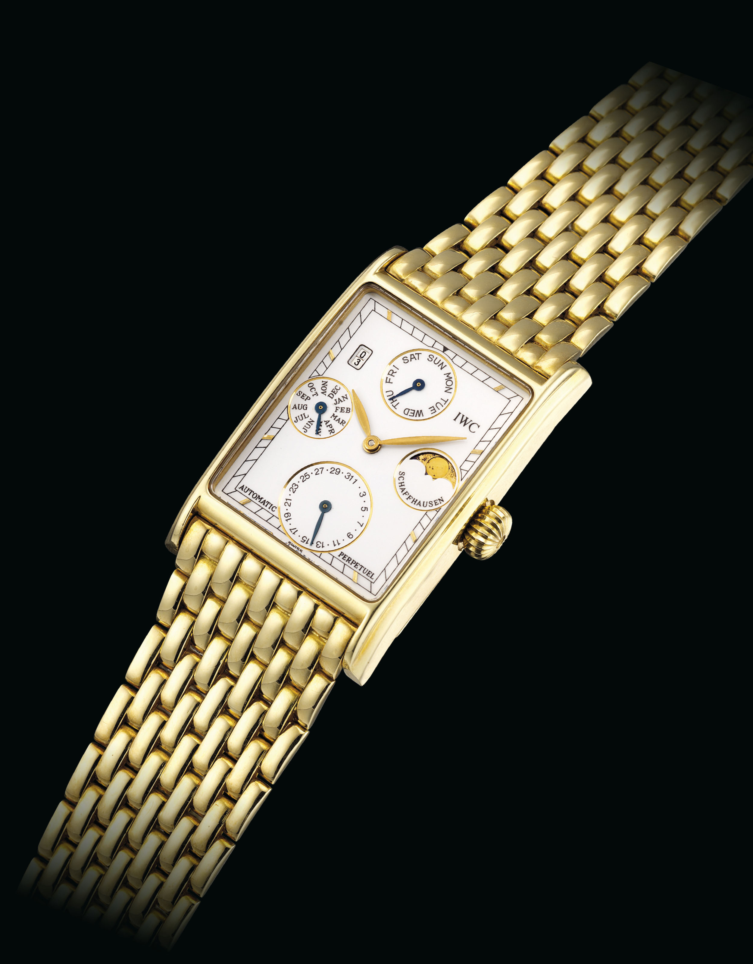 IWC. AN 18K GOLD AUTOMATIC PERPETUAL CALENDAR RECTANGULAR WRISTWATCH