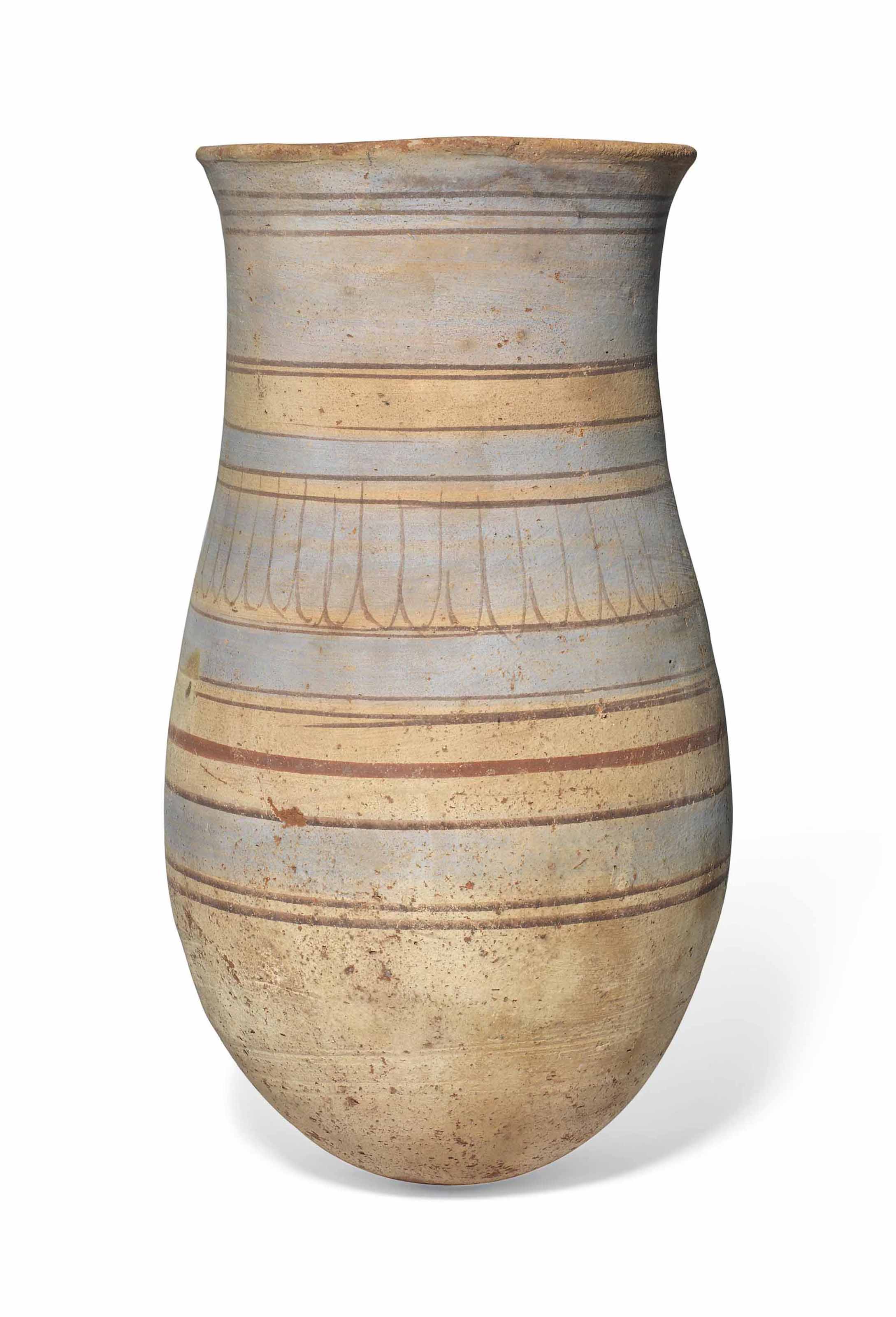 AN EGYPTIAN PAINTED POTTERY JAR