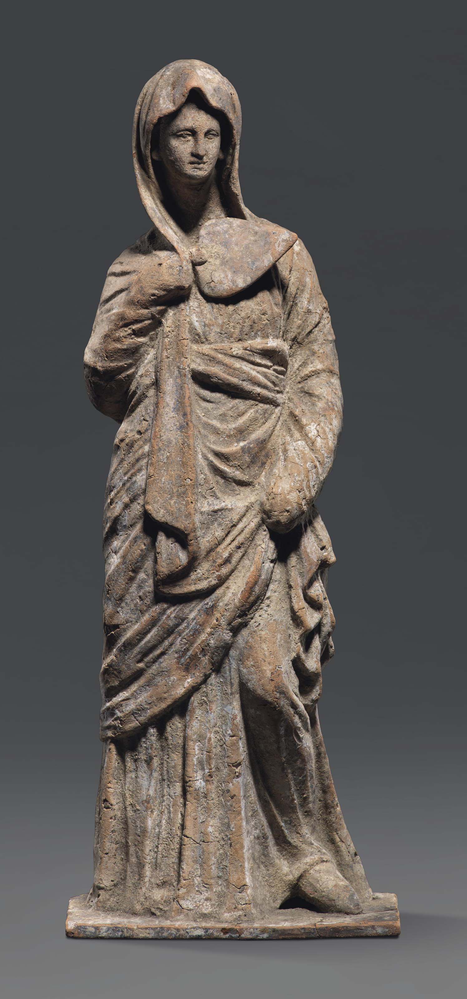 A GREEK TERRACOTTA FEMALE FIGURE