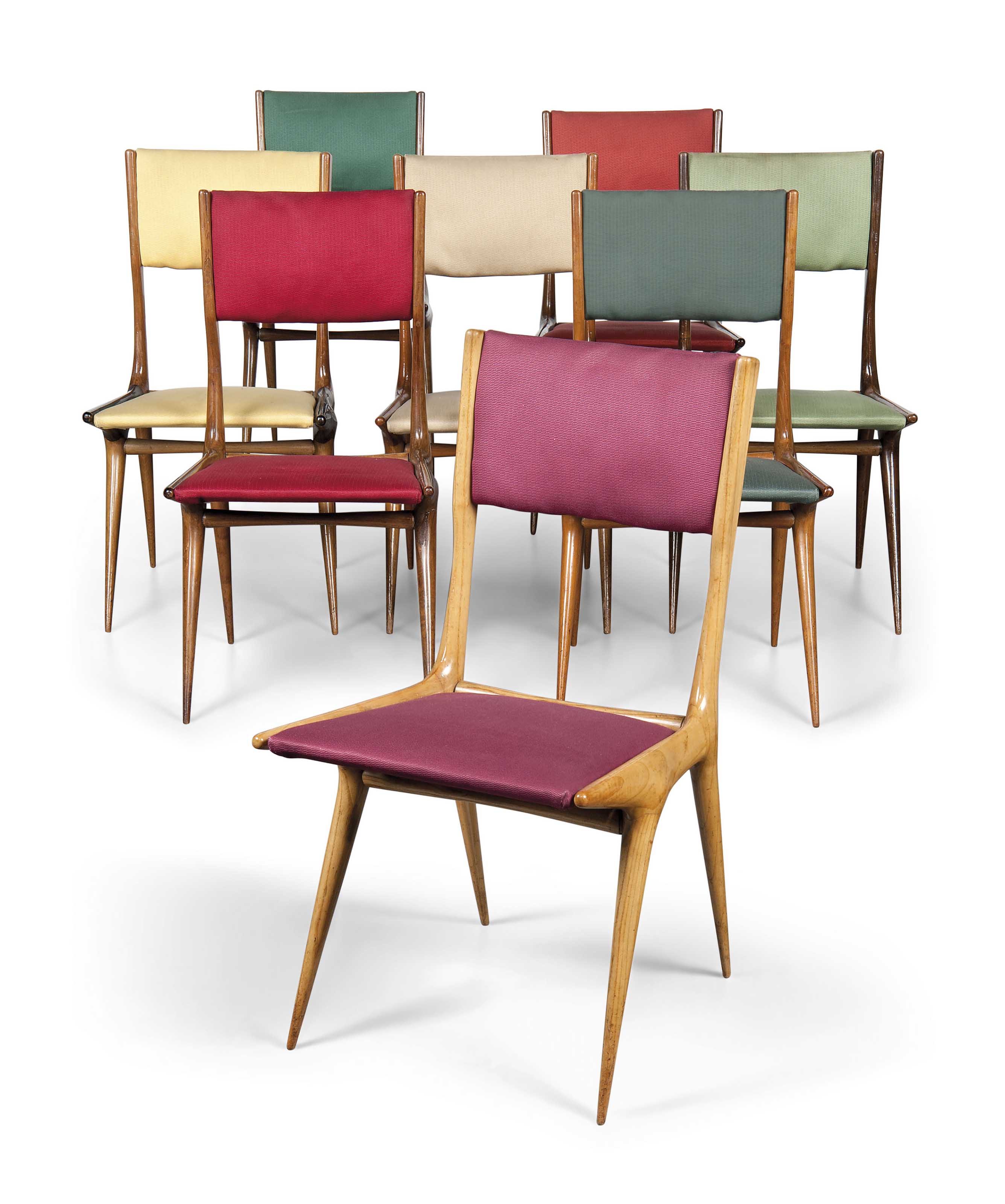 Carlo de Carli (1910-1999), An important dining suite, 1949. Original upholstery, walnut, mahogany, fruitwood, ash, macassar ebony, comprising eight chairs and a dining table.  Dining table: 30 in (76 cm) high; 83 in (211 cm) long; 35&frac34; in (91 cm) wide, chairs: 33&frac12; in (85 cm) high; 18 in (46 cm) wide; 21&frac12; in (55 cm) deep. Estimate: &pound;10,000-15,000. This lot is offered in Design on 26 October 2016 at Christie&rsquo;s in London, King Street