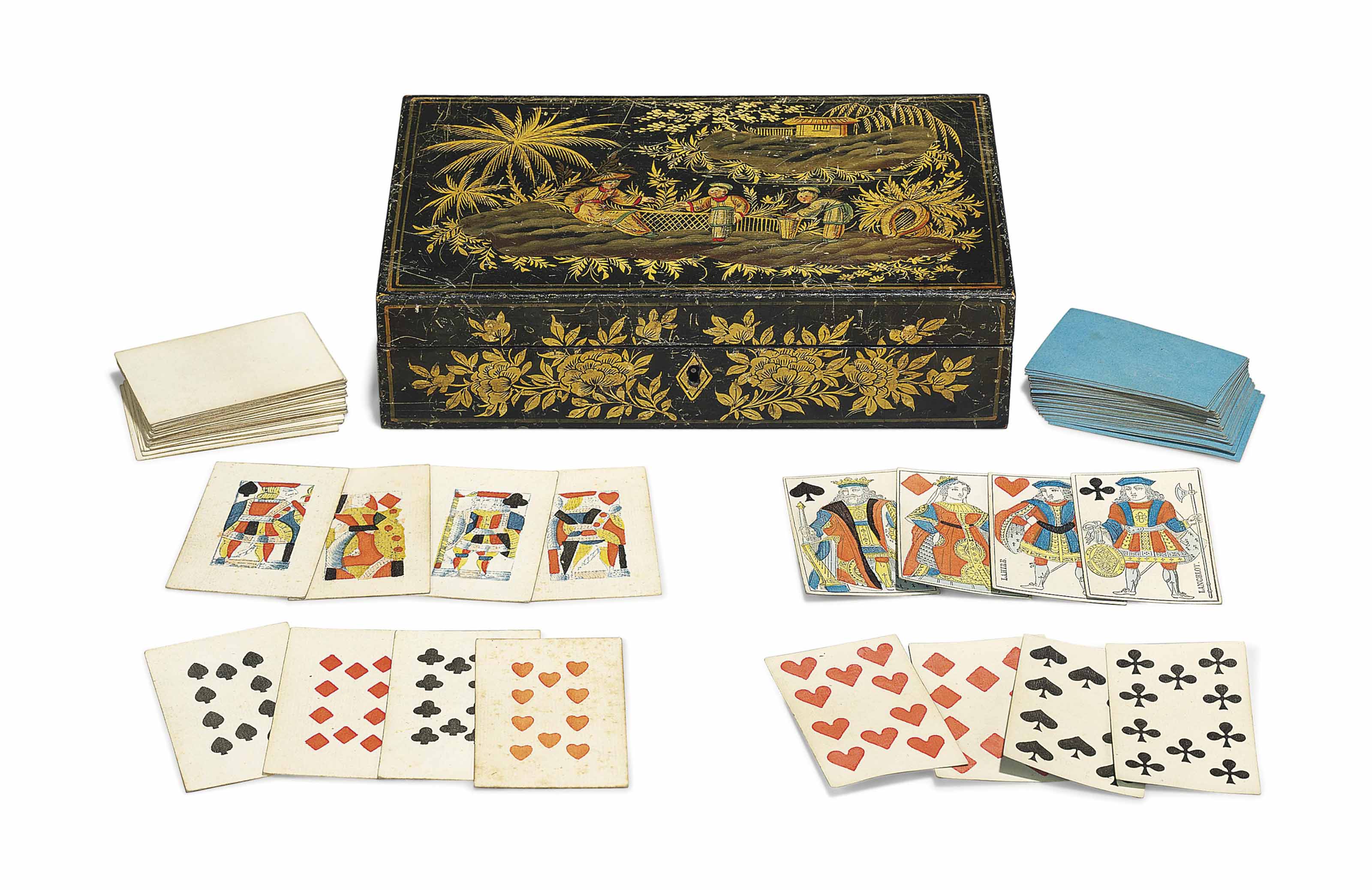 A LATE VICTORIAN LEATHERBOUND BRIDGE SET AND TWO SETS OF PLAYING CARDS