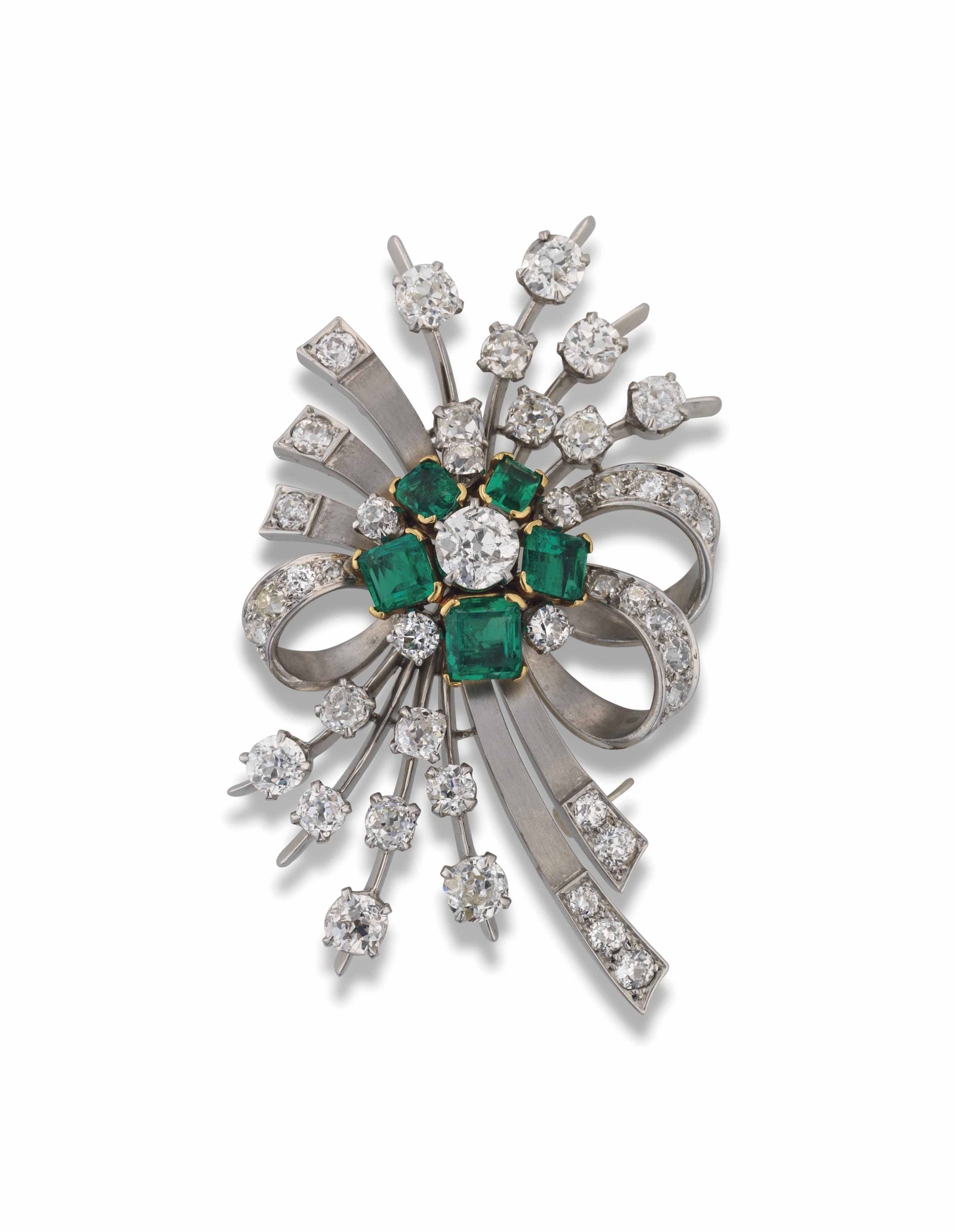 AN EMERALD AND DIAMOND BROOCH