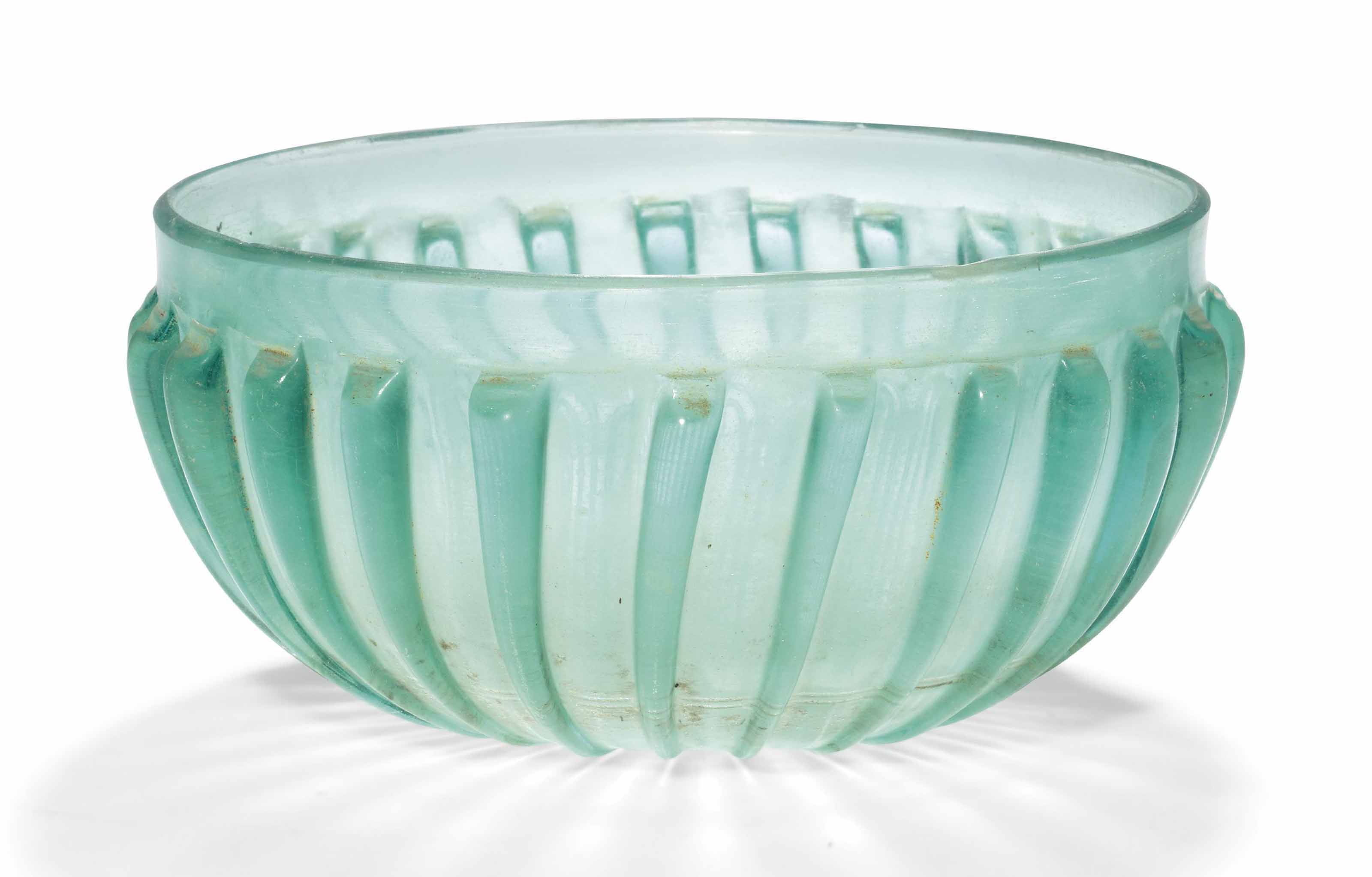 A ROMAN BLUEGREEN GLASS RIBBED BOWL , CIRCA EARLY 1ST CENTURY A.D. Christie's