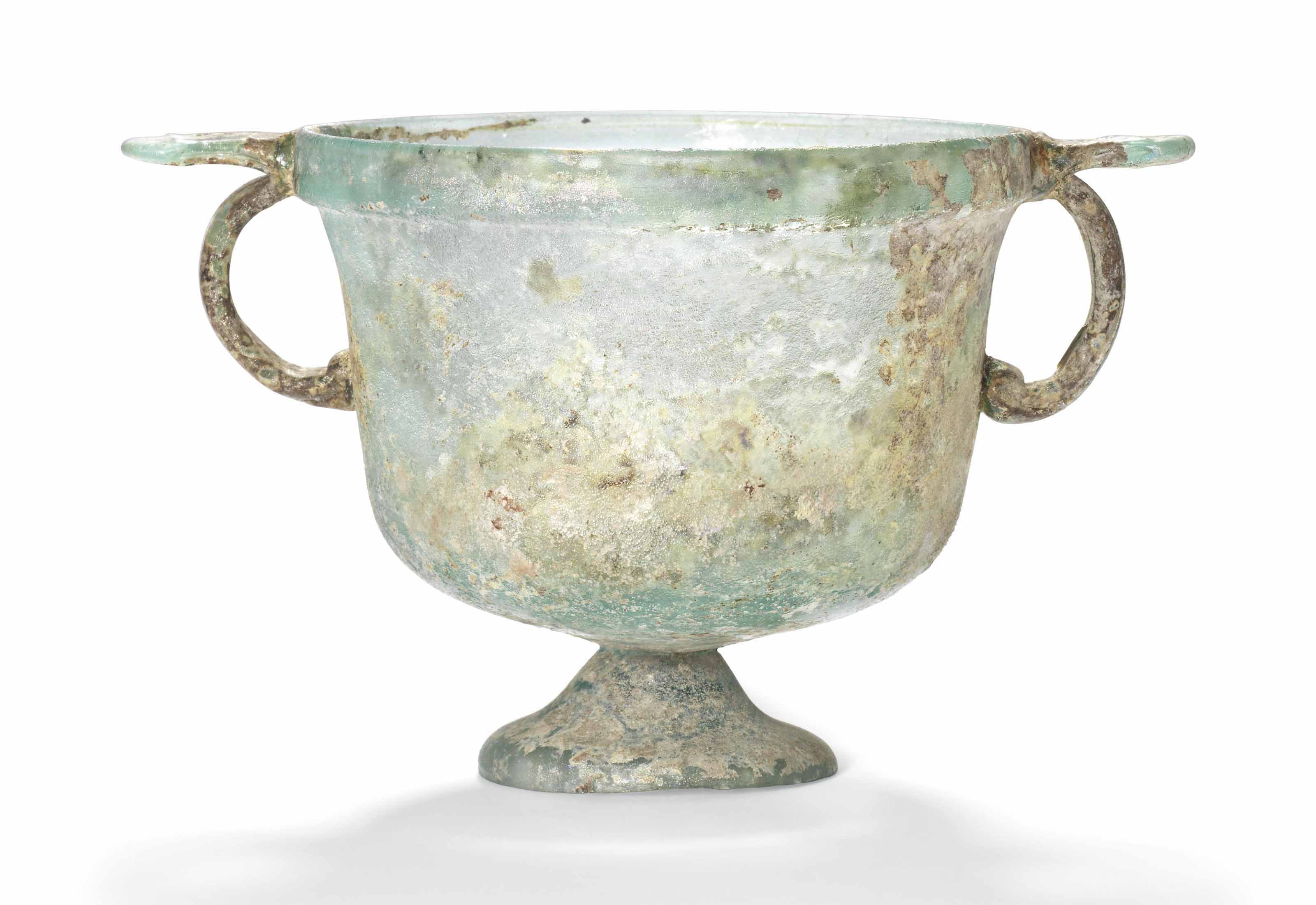 A ROMAN GREEN GLASS SKYPHOS , CIRCA LATE 1ST CENTURY A.D. Christie's