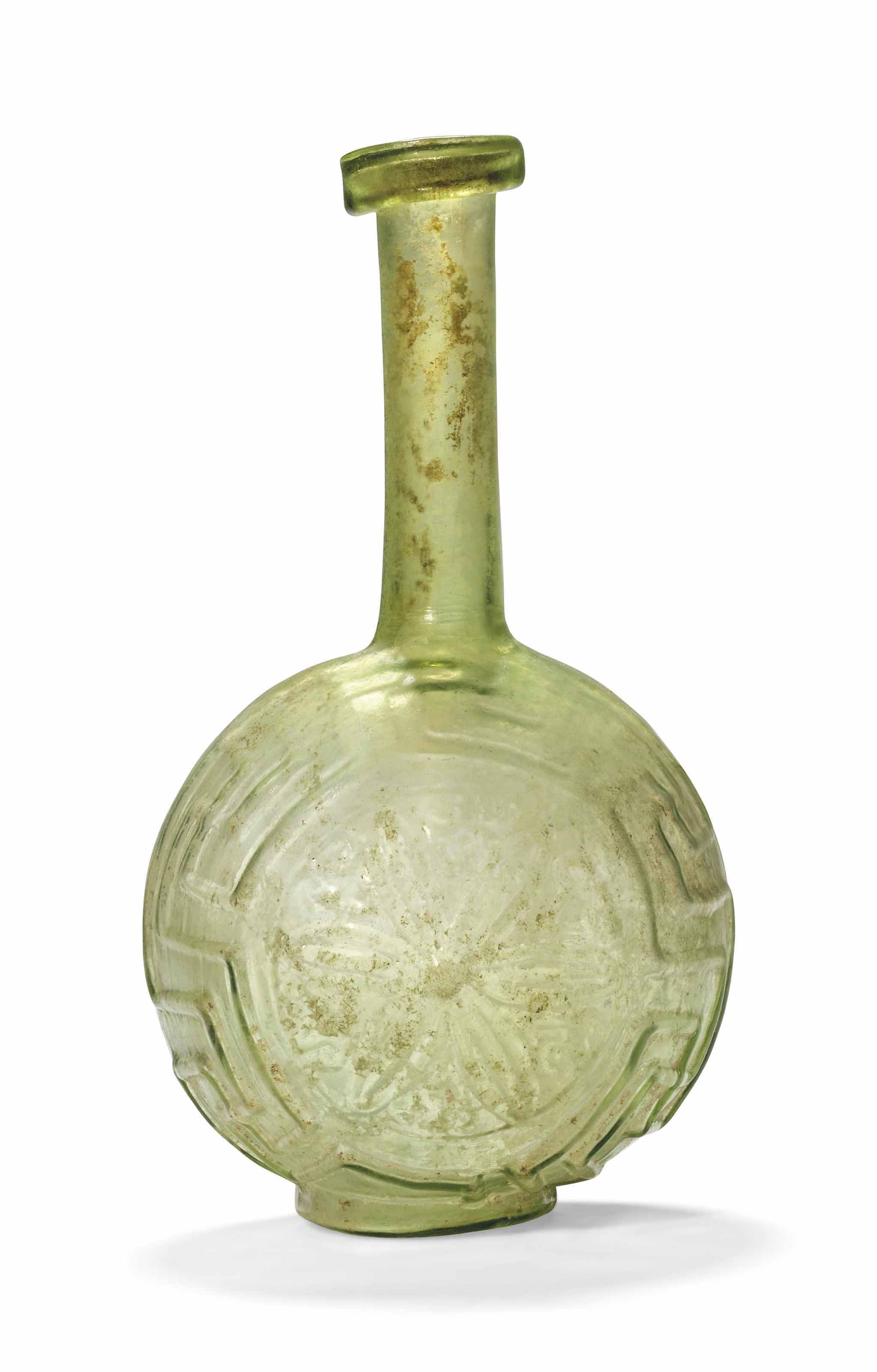 A ROMAN PALE GREEN GLASS BOTTLE