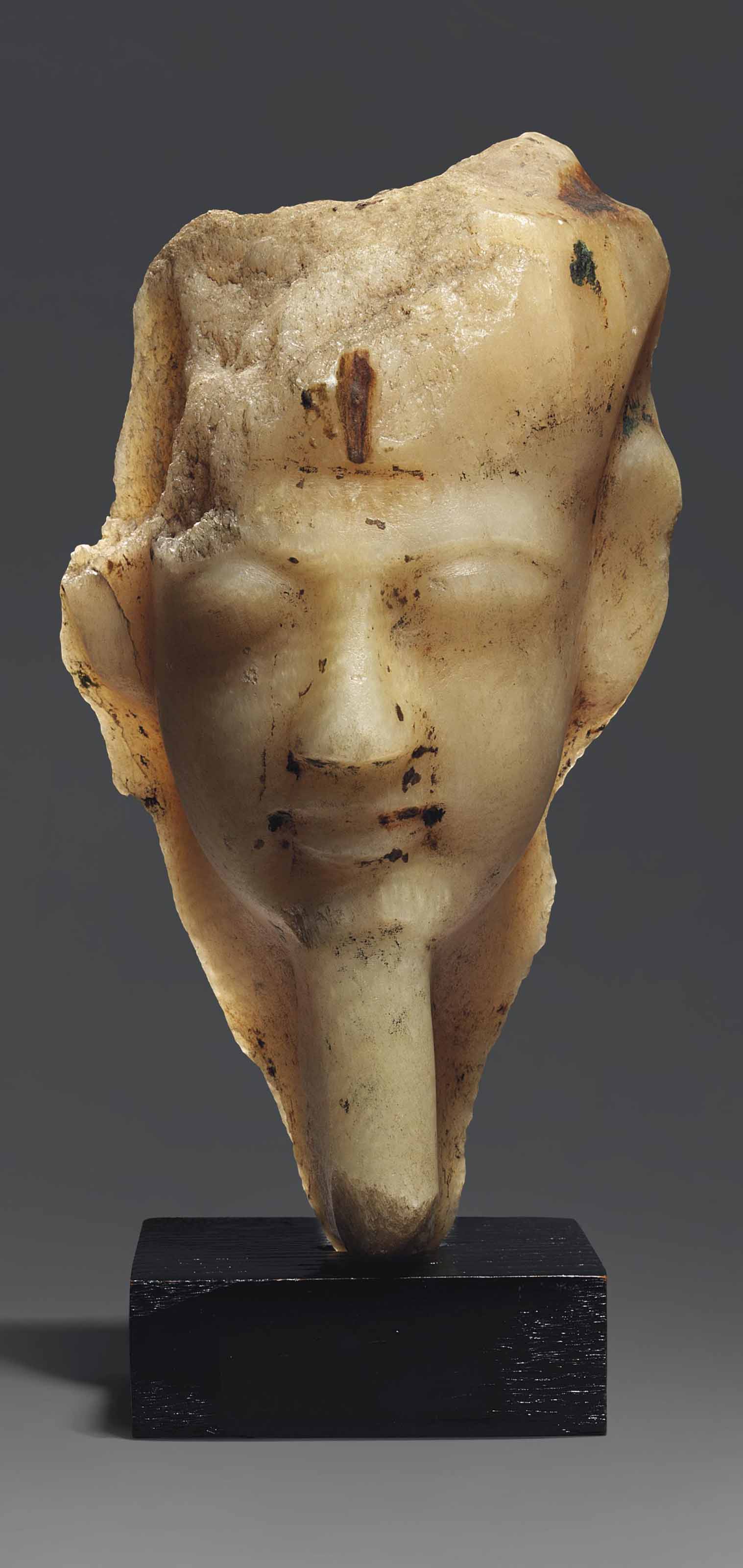 AN EGYPTIAN ALABASTER ROYAL HEAD , NEW KINGDOM, 19TH DYNASTY, CIRCA