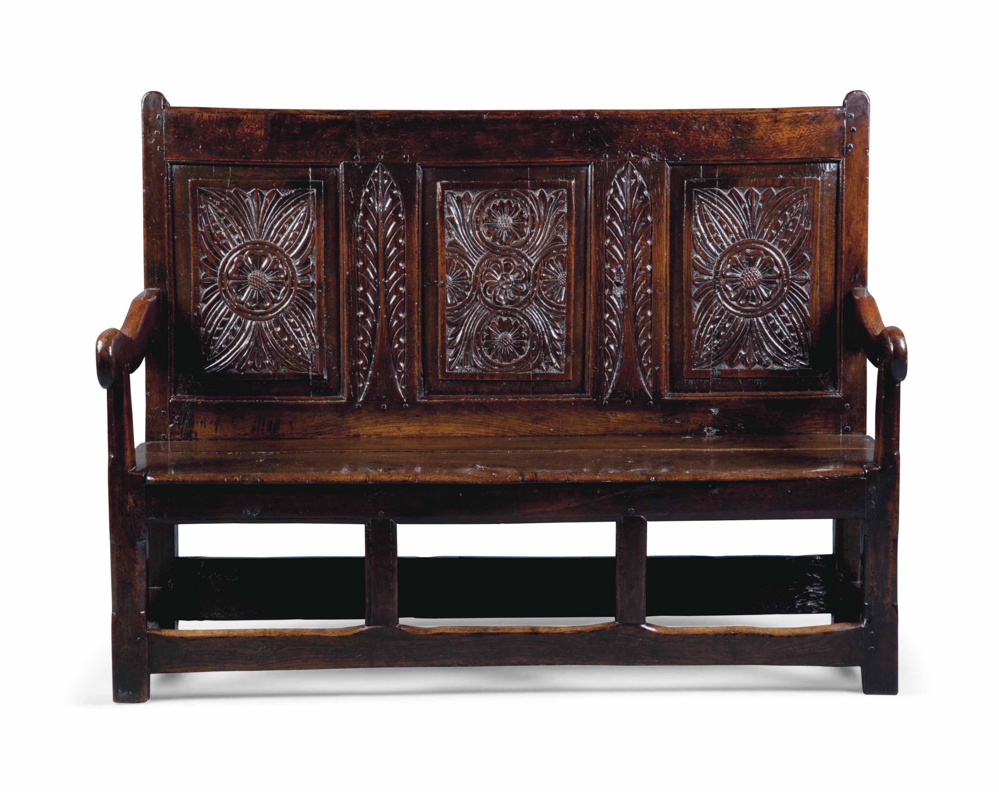 A CHARLES II OAK SETTLE
