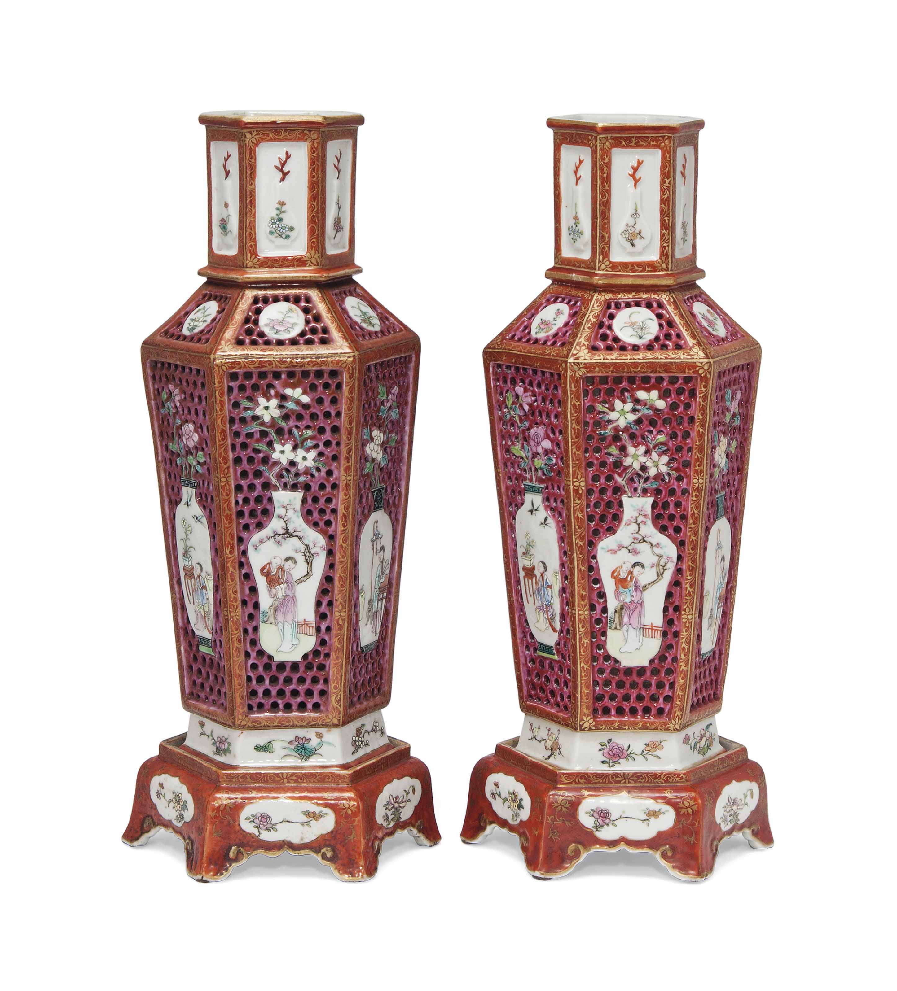 A PAIR OF CHINESE FAMILLE ROSE RETICULATED HEXAGONAL VASES AND STANDS