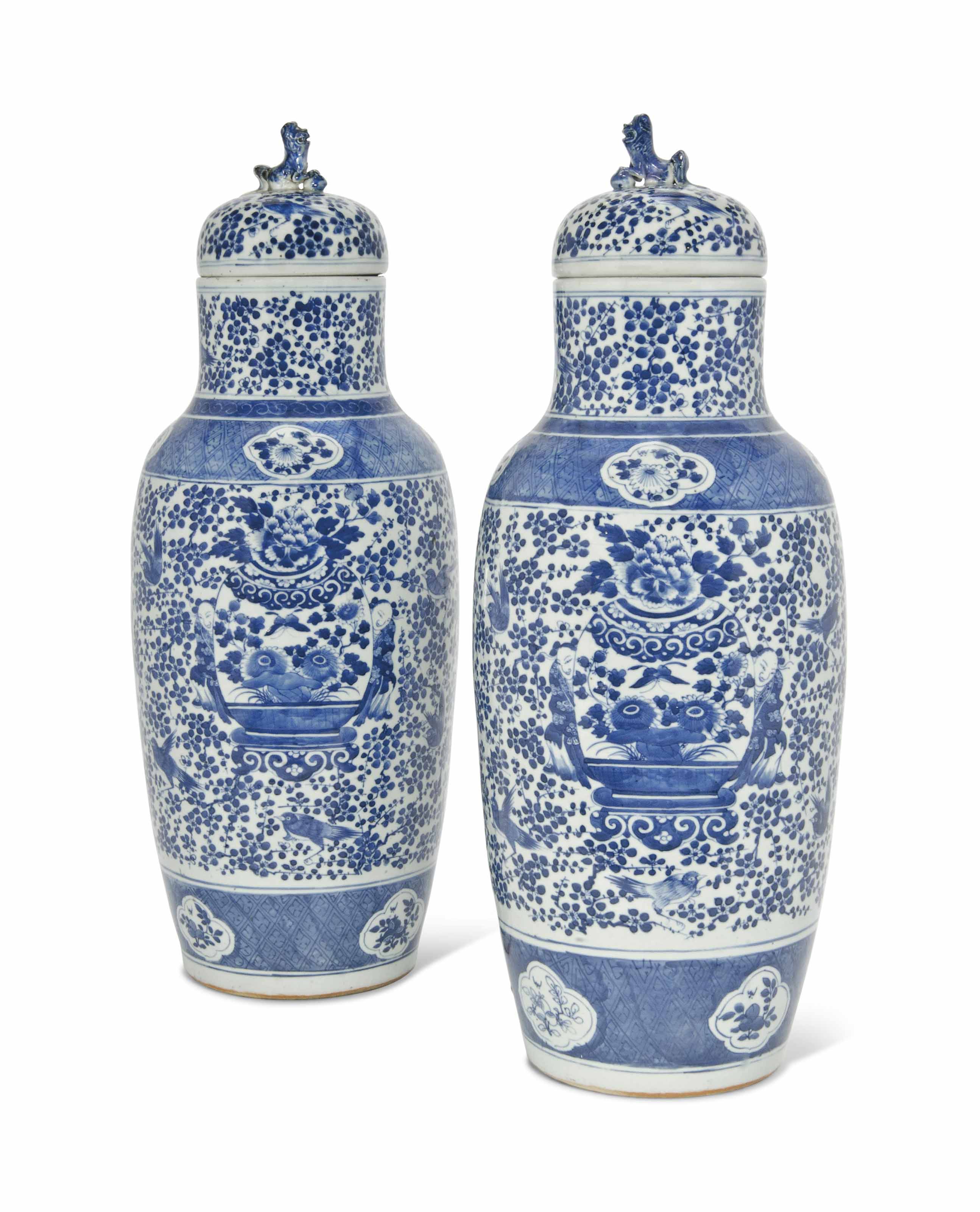 A Pair Of Tall Chinese Blue And White Vases And Covers 19th