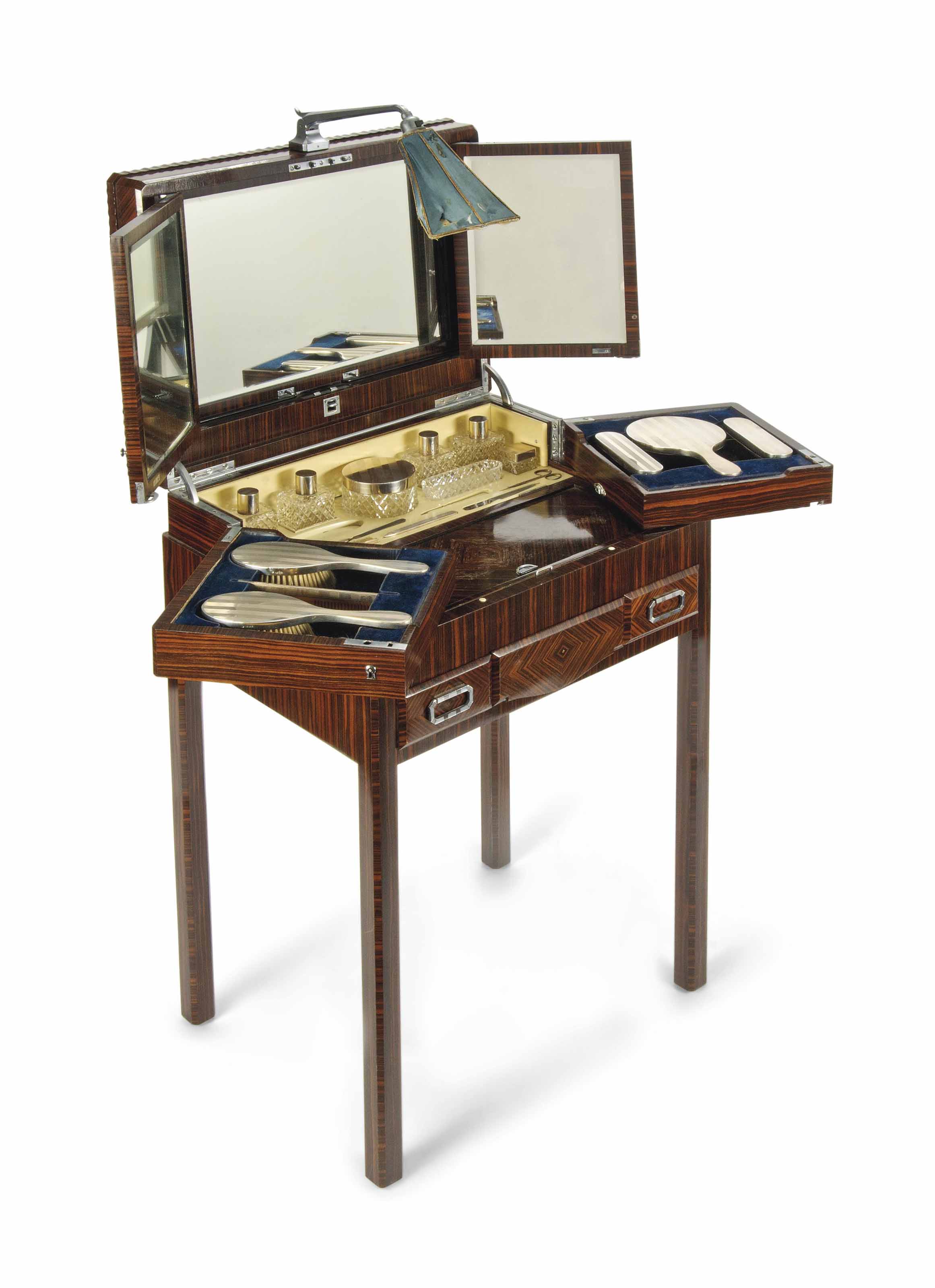 An Art Deco Macassar Ebony And Silver Fitted Dressing Table With