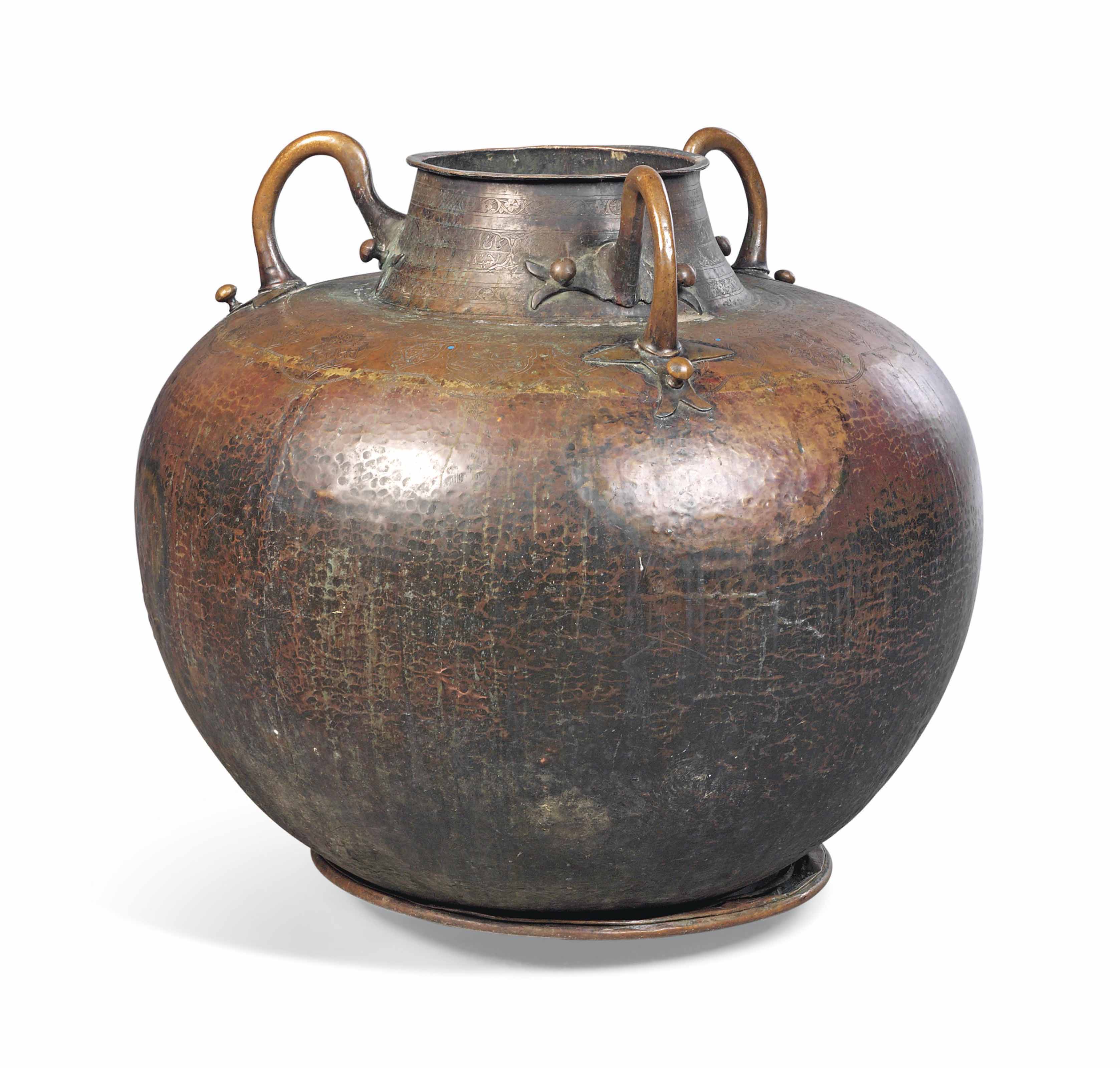 A LARGE NORTH AFRICAN COPPER THREEHANDLED WATER POT , LATE 19TH CENTURY Christie's
