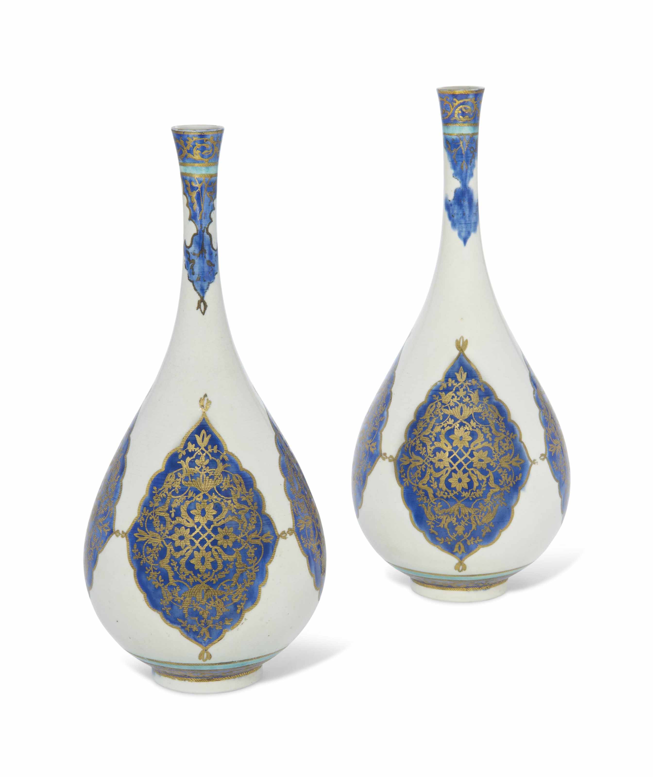 A PAIR OF LARGE GILT BLUE AND WHITE BOTTLE VASES , SAMSON, FRANCE